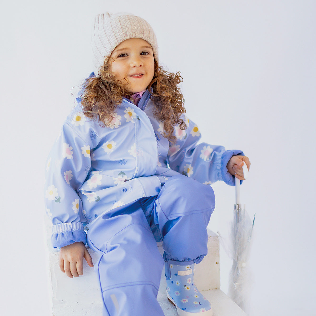 Blue rain overalls, child