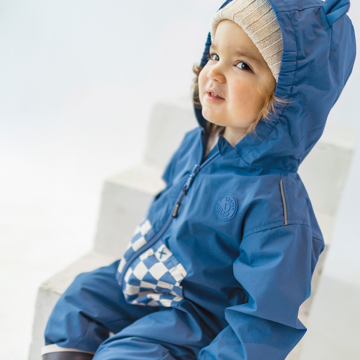 Manteau une pièce bleu à motif damier, bébé