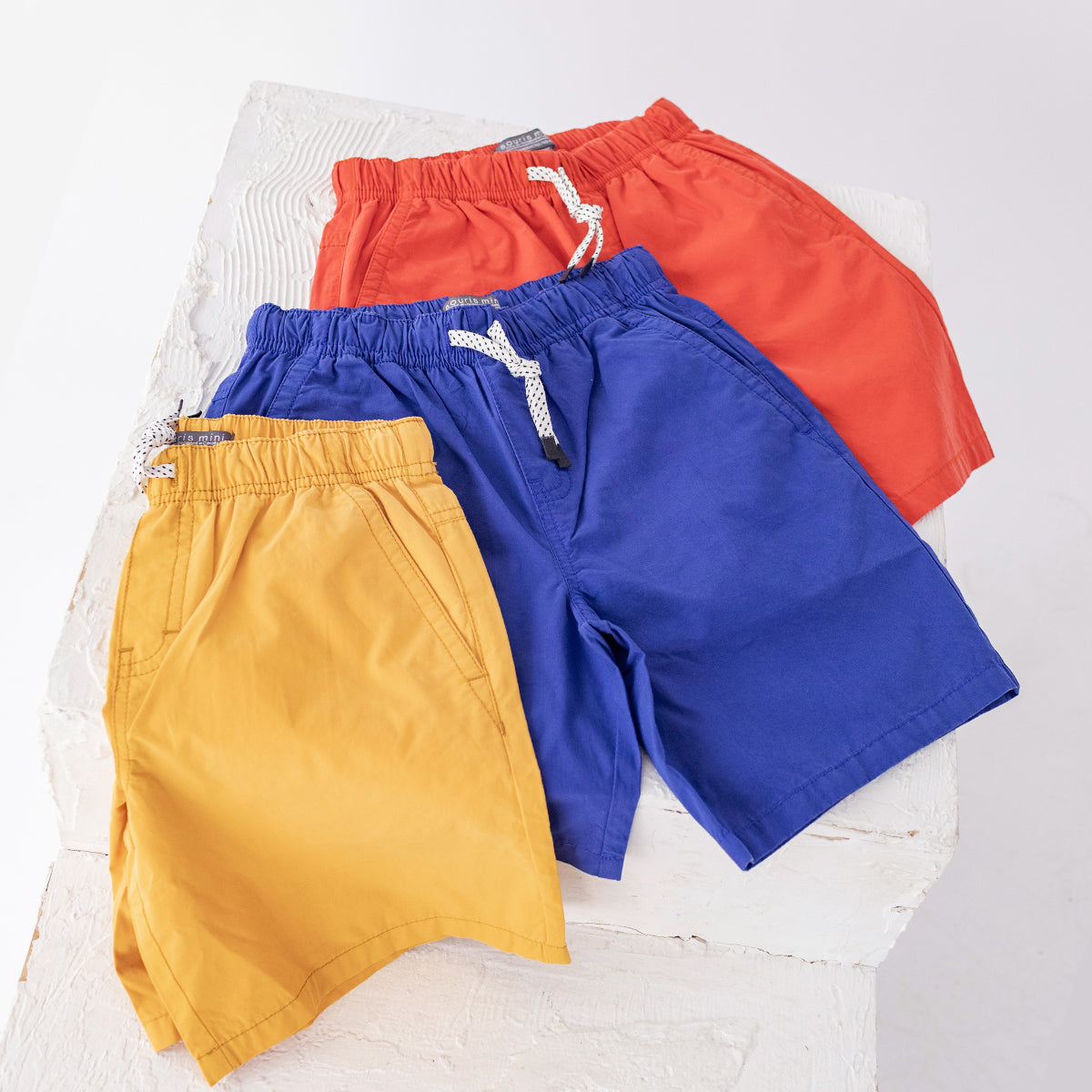 Red canvas Bermuda shorts, child