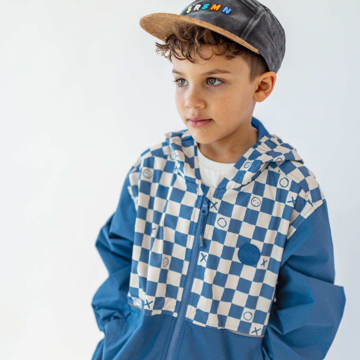 Blue windbreaker with checkerboard print, child