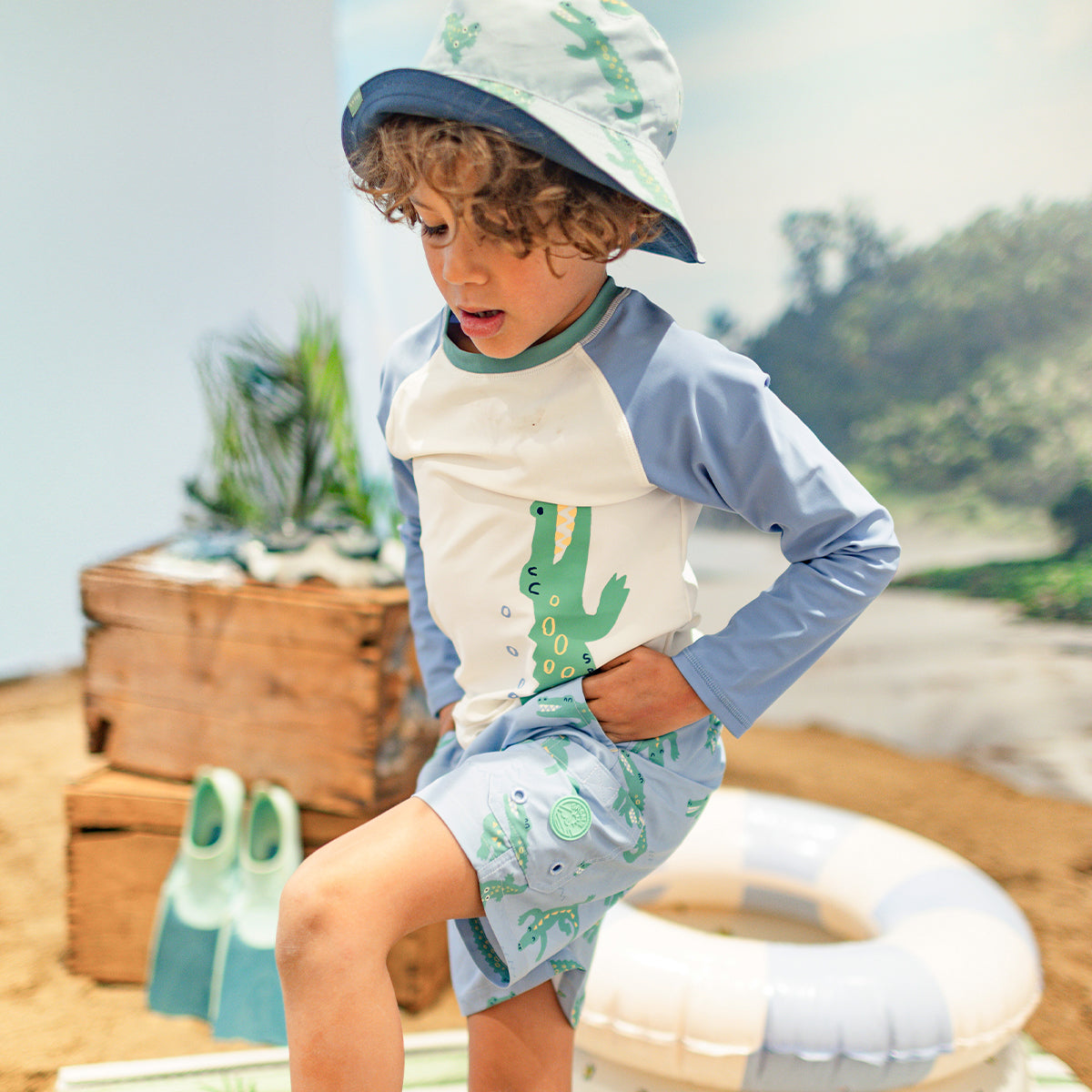 Blue and cream rashguard with crocodile, child