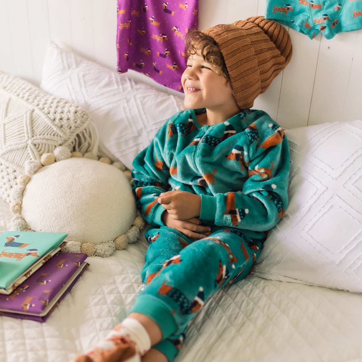 Turquoise plush one-piece pajamas with dog patterns, child