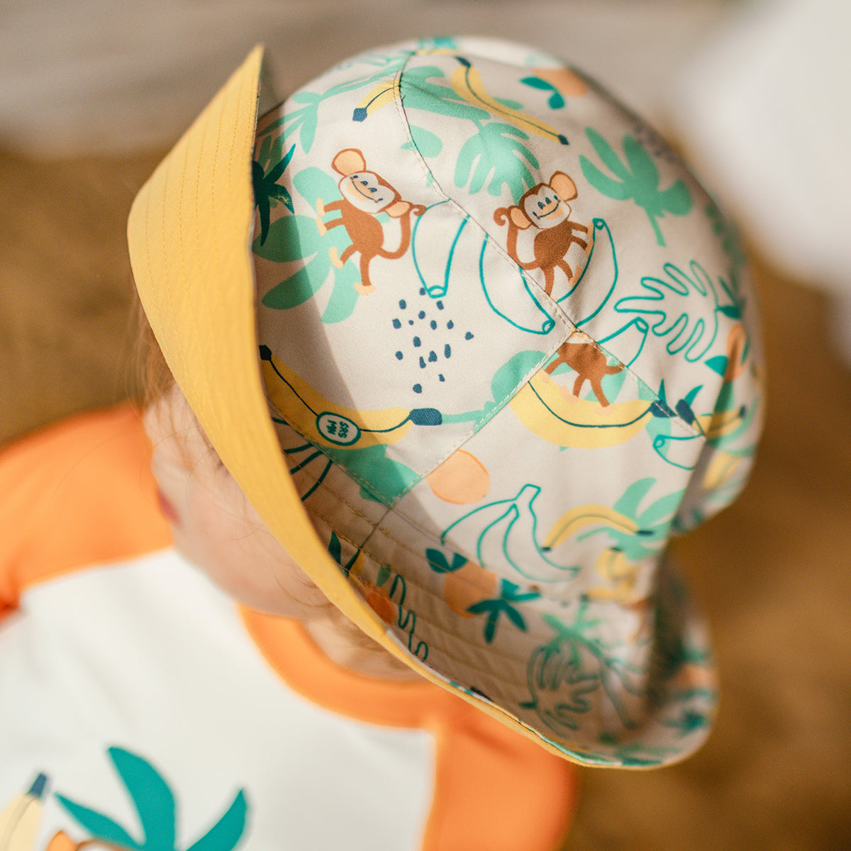 Chapeau de soleil réversible beige à motifs tropicaux, bébé