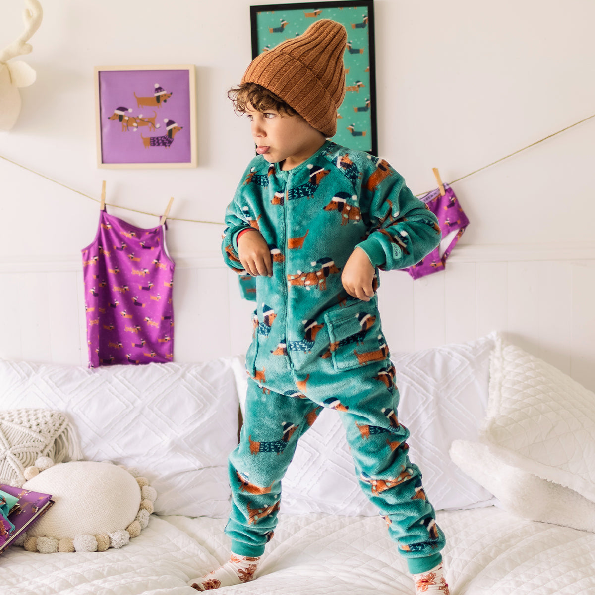 Turquoise plush one-piece pajamas with dog patterns, child