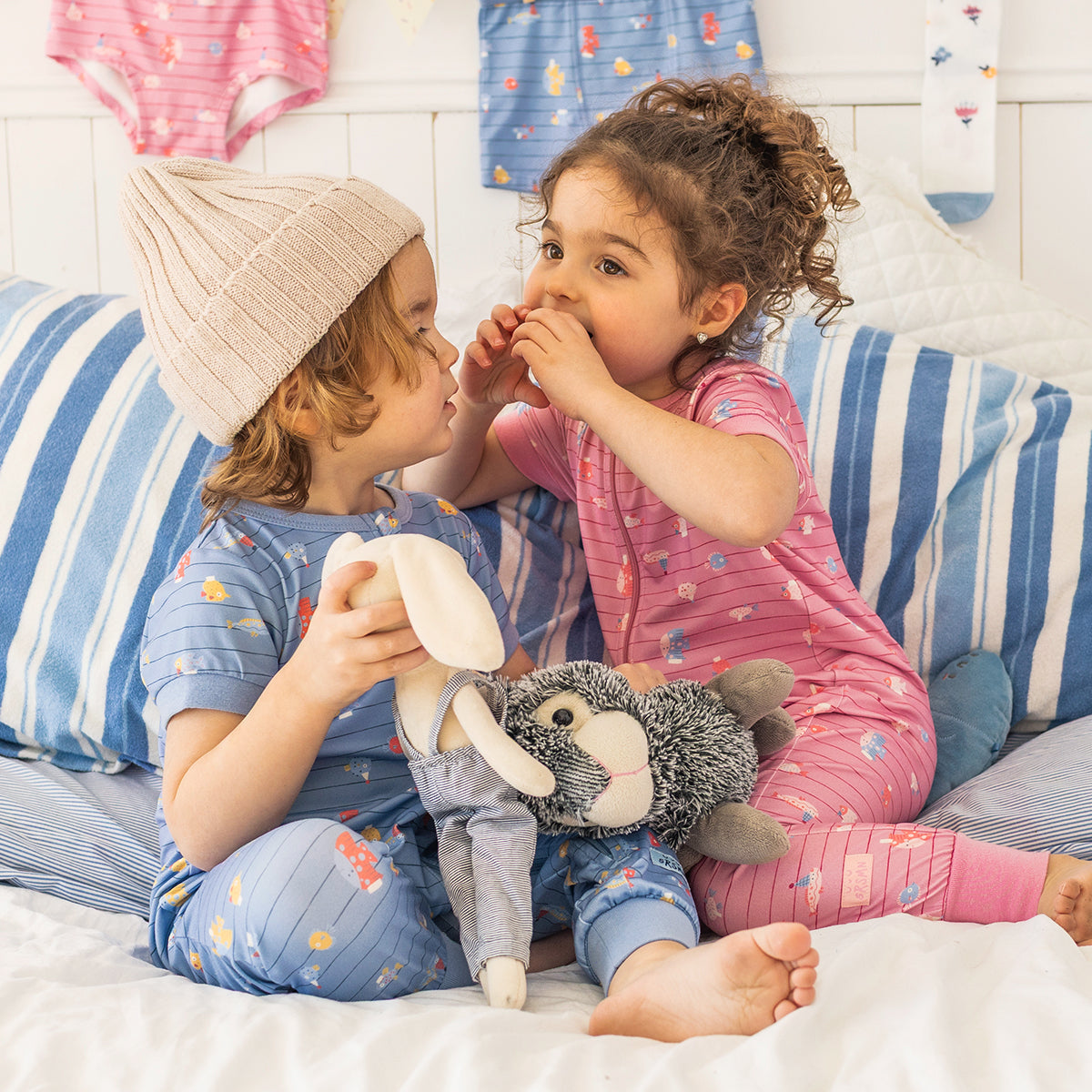 Blue one-piece pajamas with stripes and fish patterns, baby