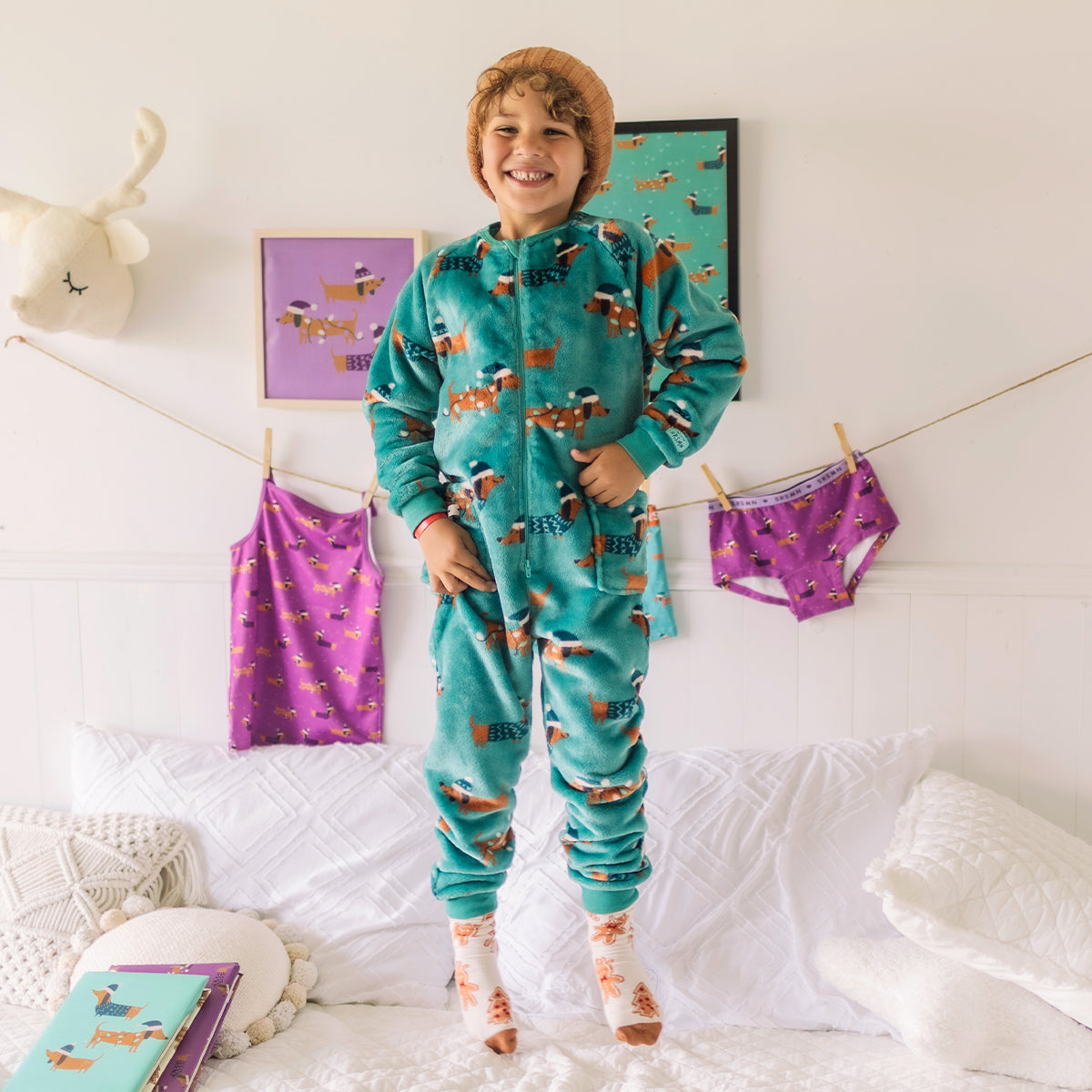 Turquoise plush one-piece pajamas with dog patterns, child