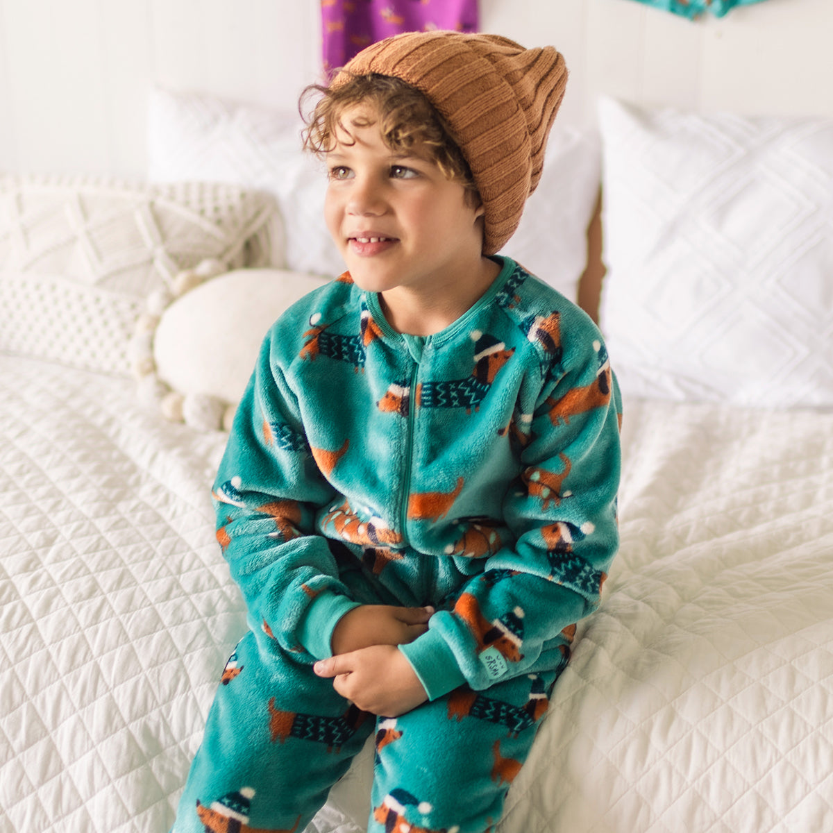 Turquoise plush one-piece pajamas with dog patterns, child