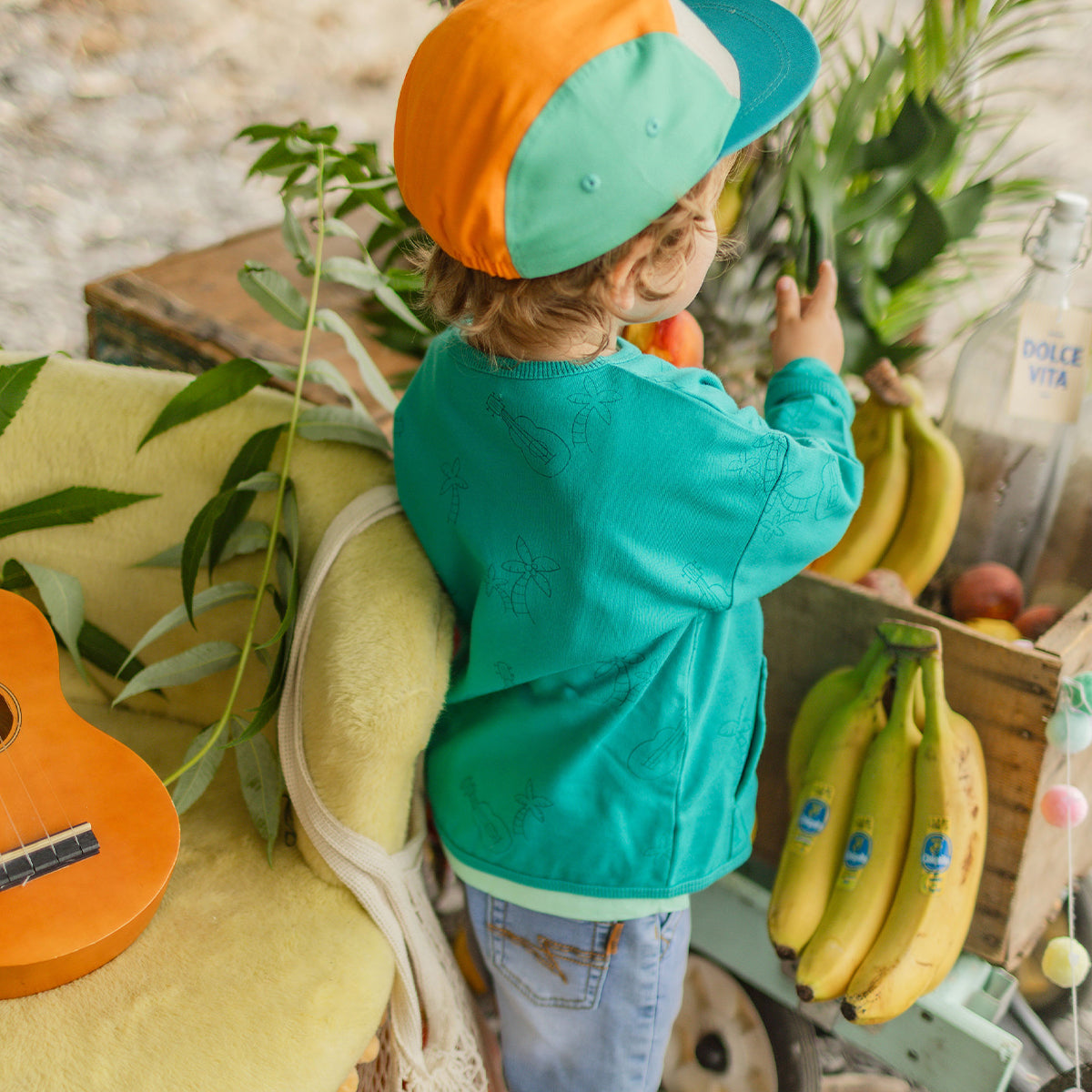 Chandail turquoise à motifs de palmiers et guitares, bébé