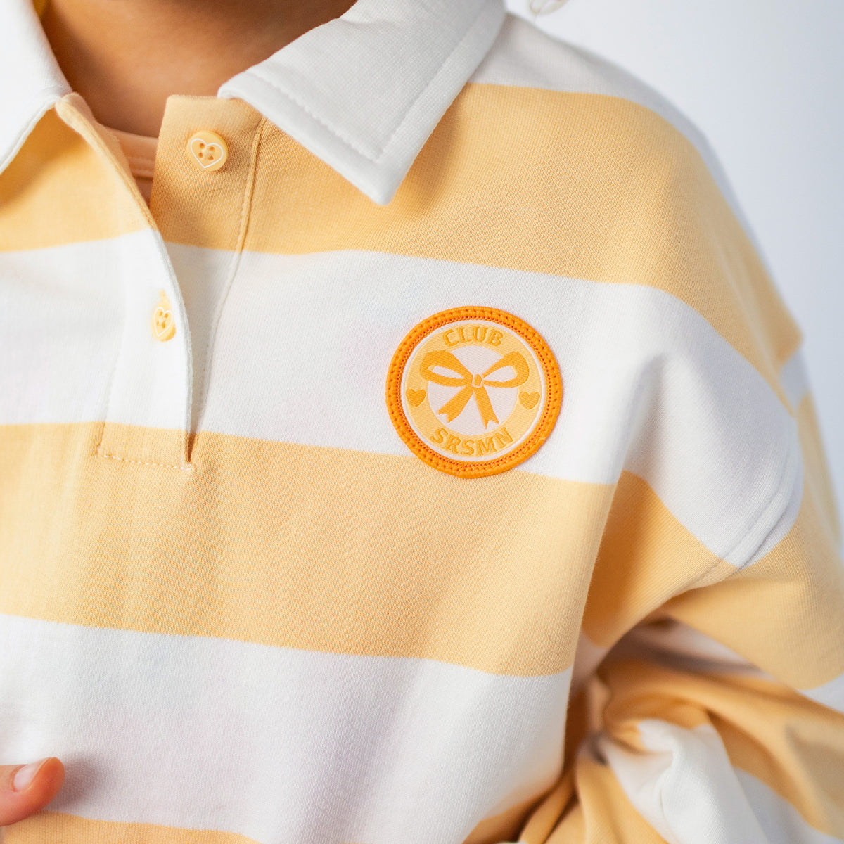 Cream and yellow striped polo shirt, child