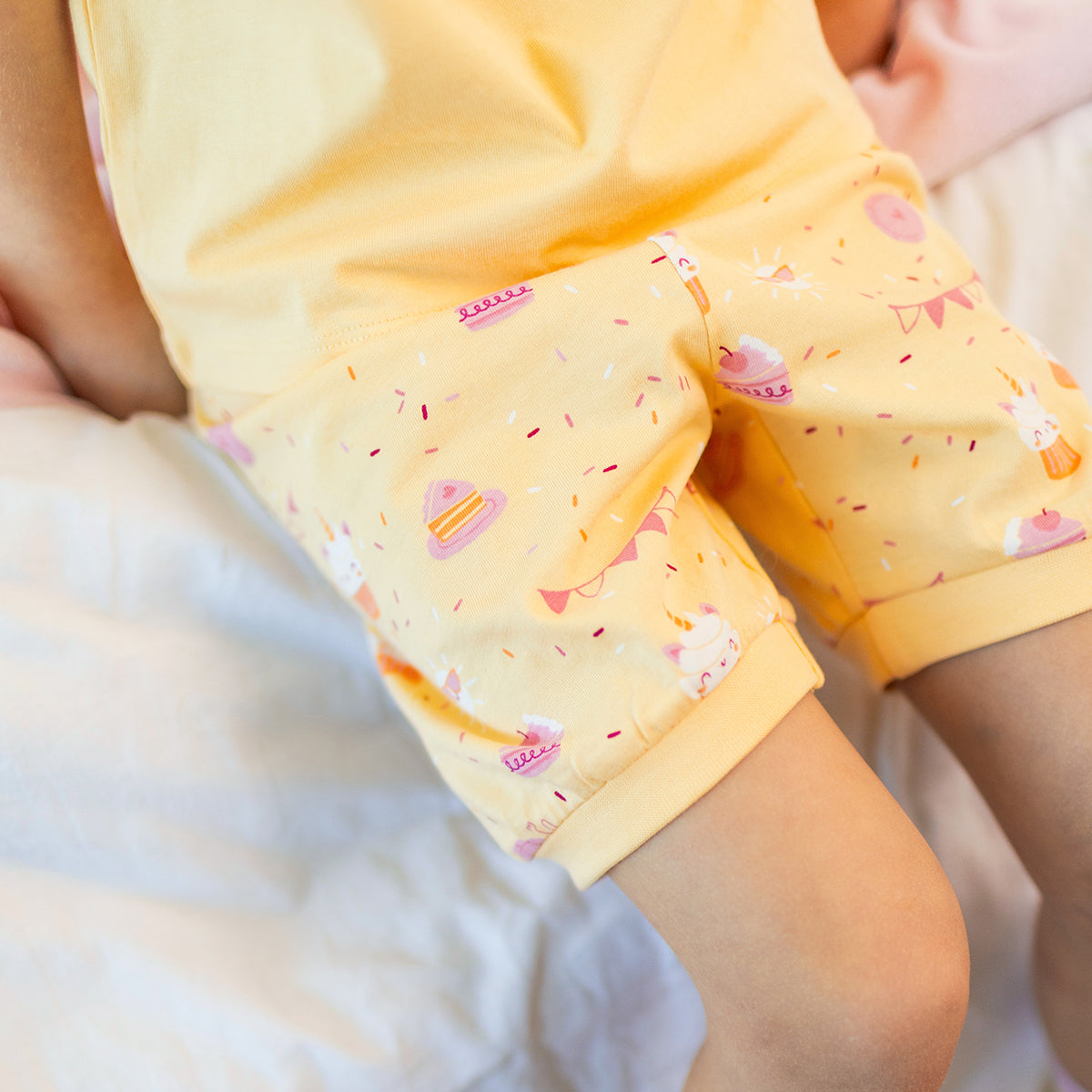 Yellow two-piece pajamas with cake pattern, child