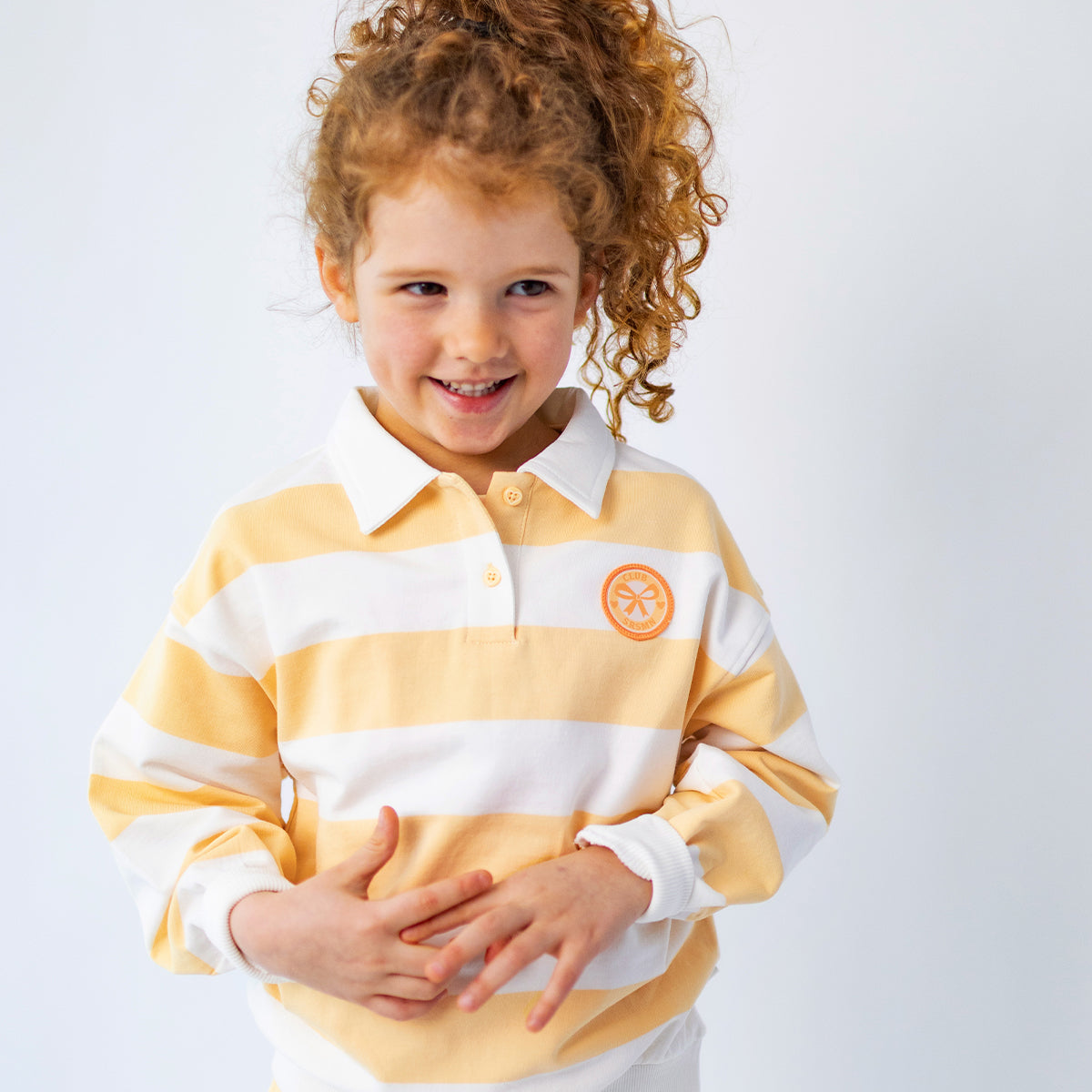 Cream and yellow striped polo shirt, child