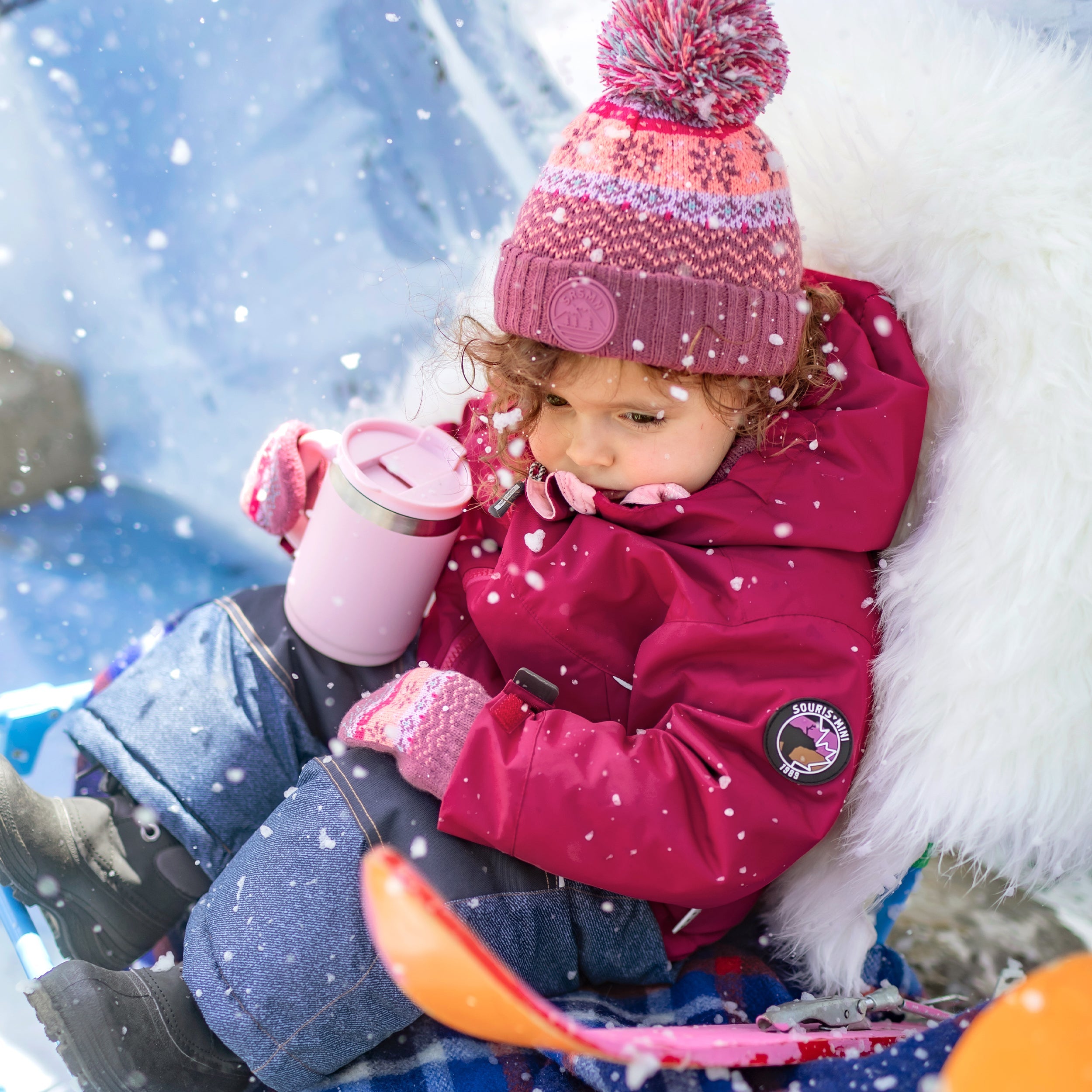 Tuque en tricot rose, pêche et turquoise à motifs avec pompon, bébé