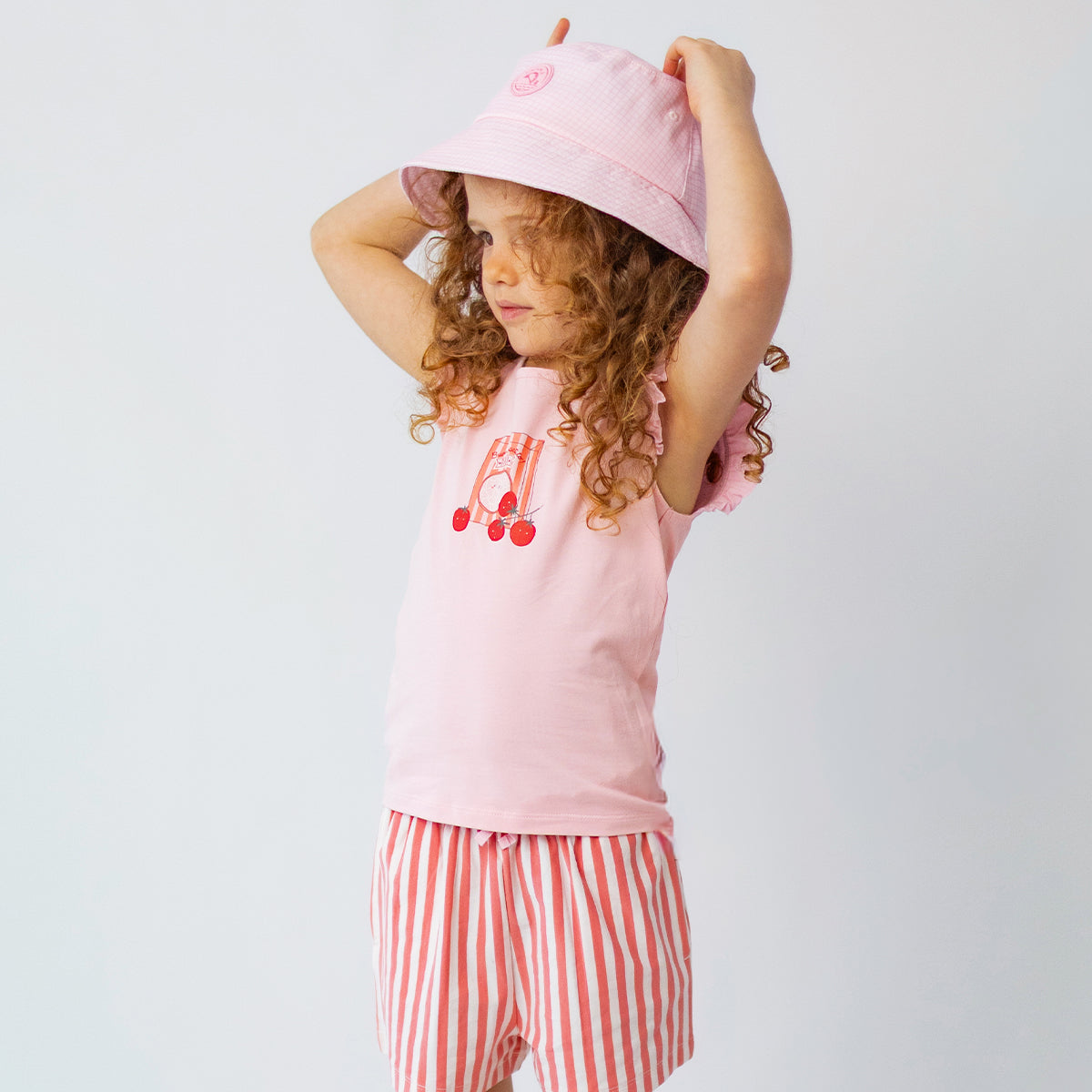 Short rose et crème à rayures, enfant