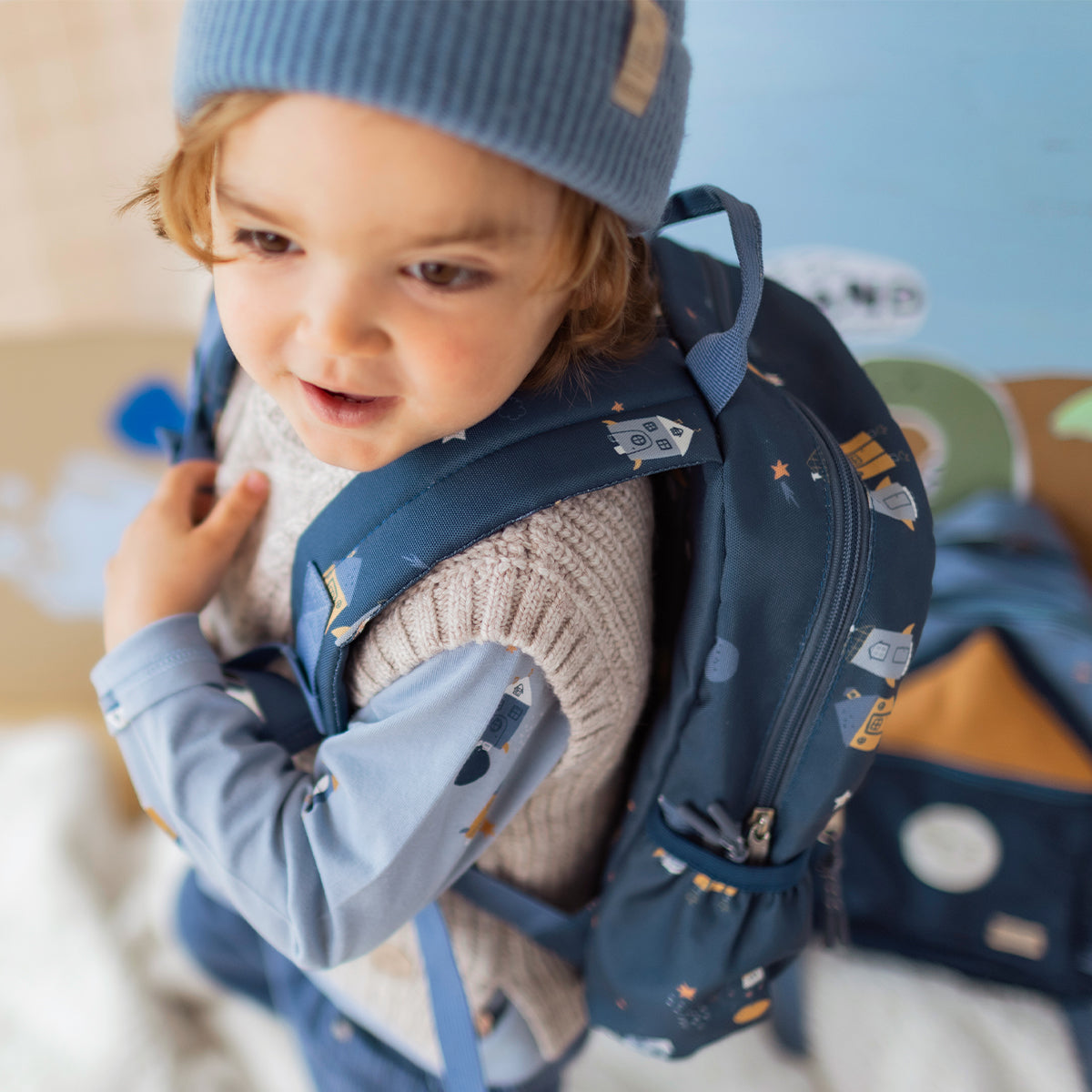 Small blue backpack with rocket and space print