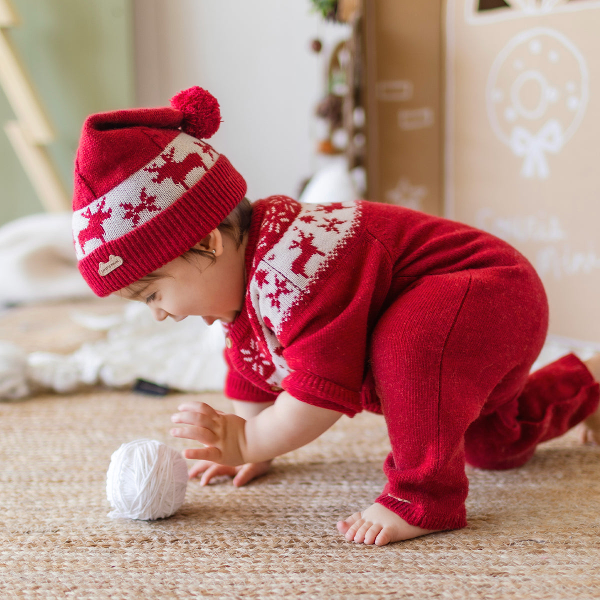 Red knit one-piece with jacquard patterns, newborn