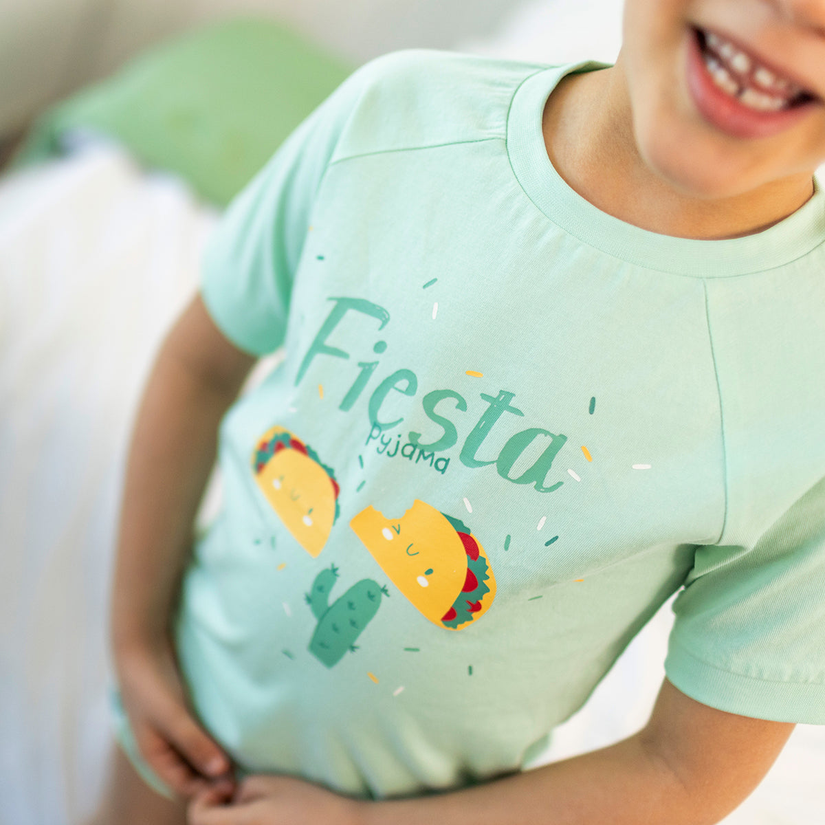 Green two-piece pajama set with fiesta pattern, child