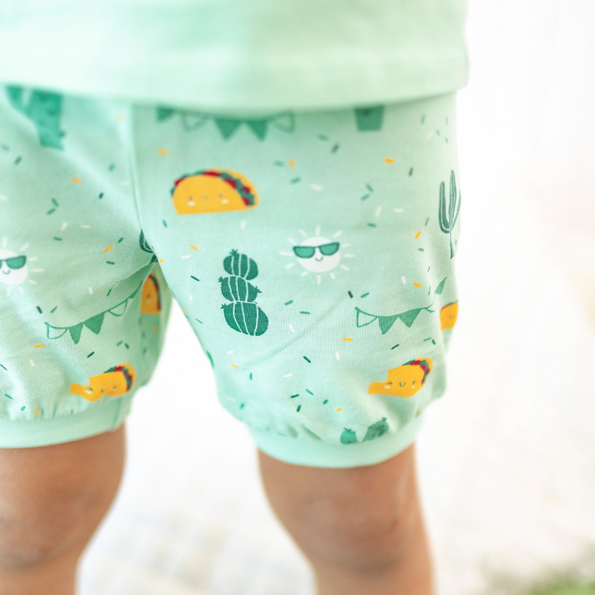 Green two-piece pajama set with fiesta pattern, child
