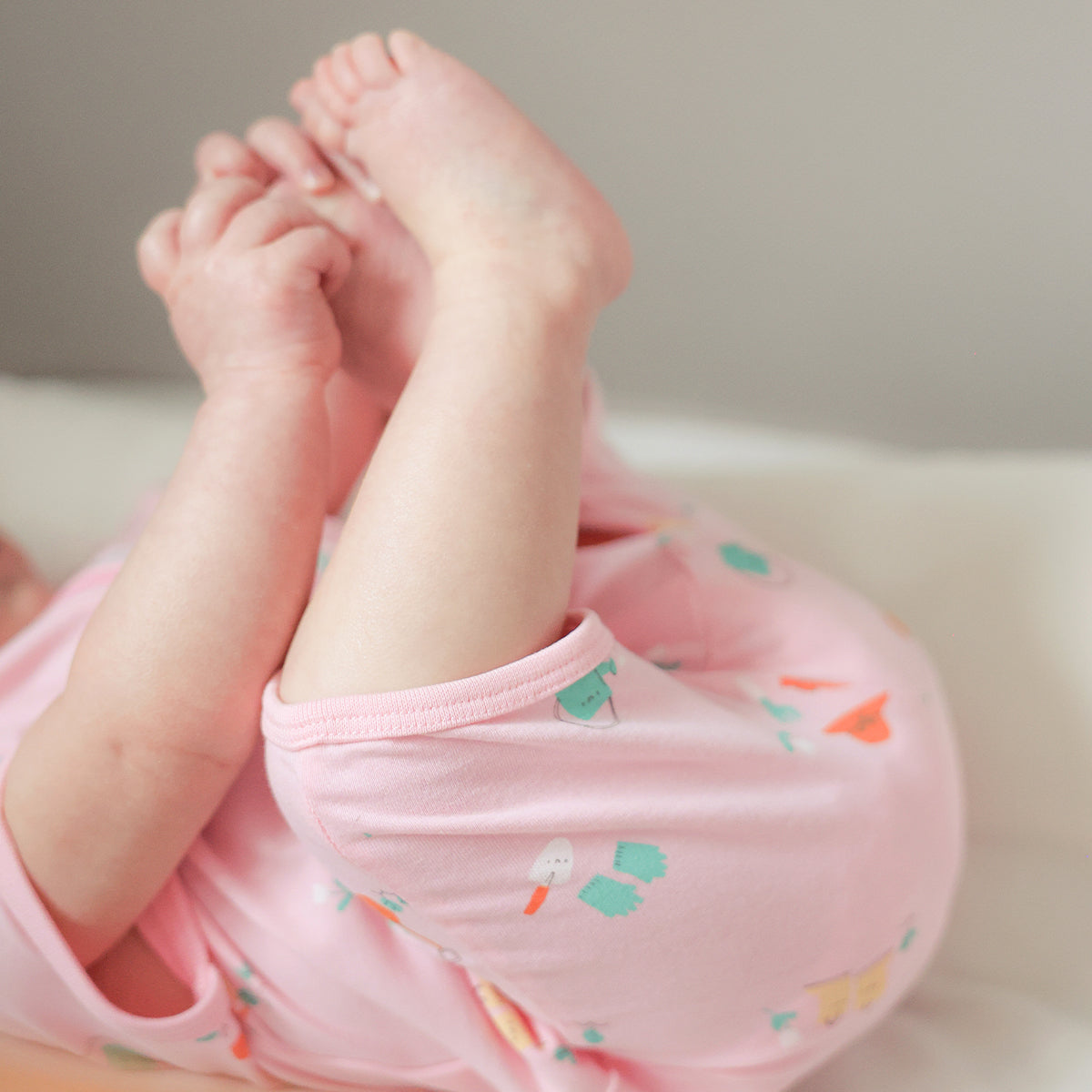 Pink patterned one-piece pajamas, newborn