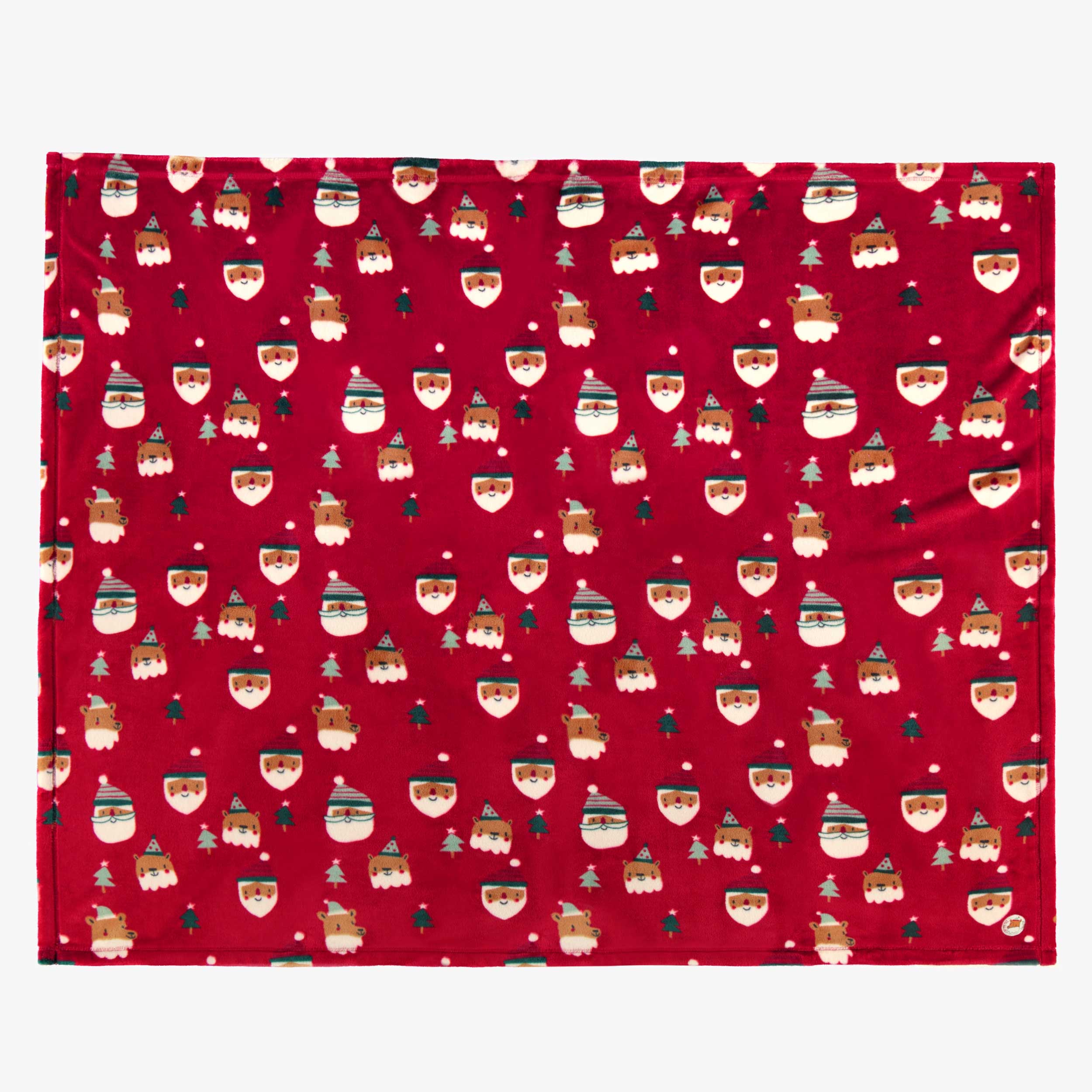Couverture dépliée rouge en peluche avec motifs des Fêtes, enfant