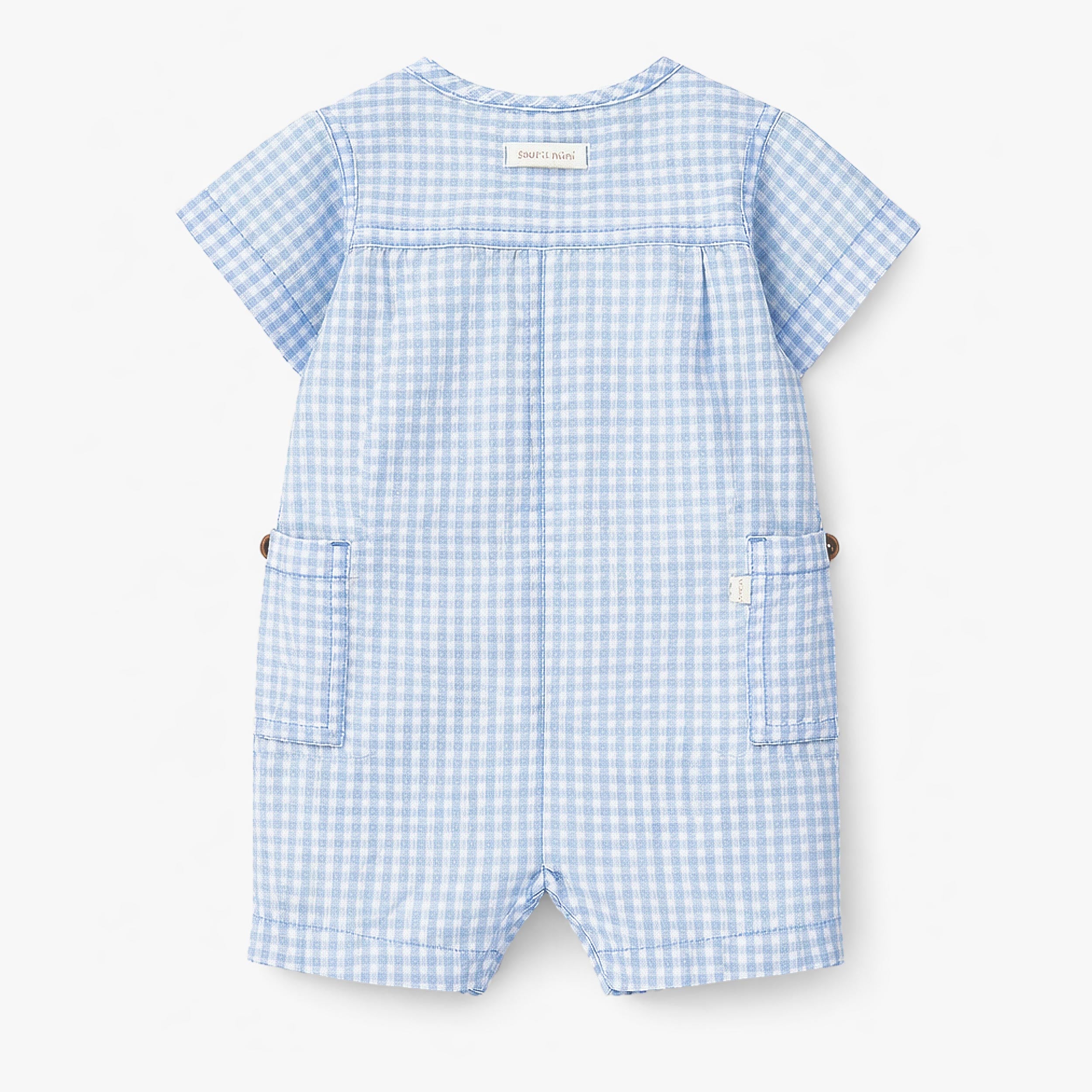 Dos de la barboteuse bleu pâle à carreaux, naissance 
