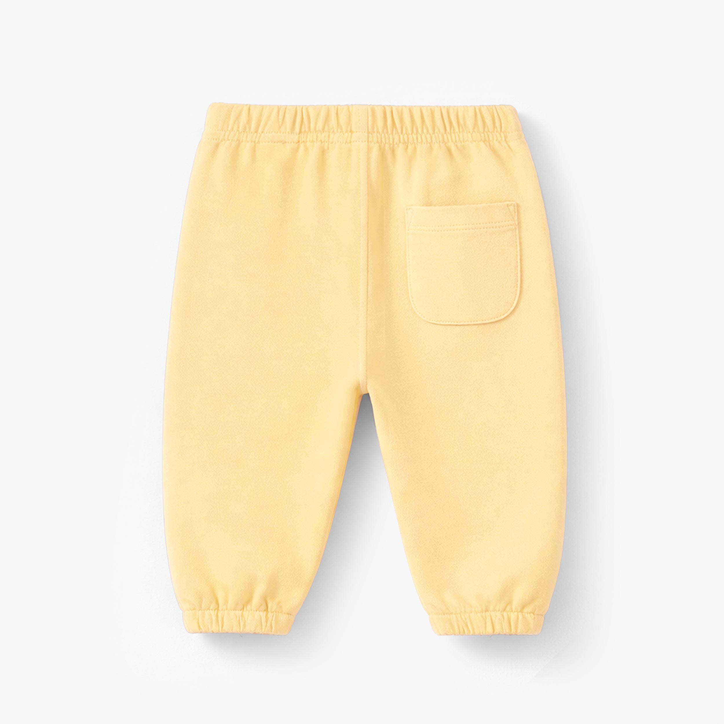 Dos du pantalon jaune style jogger, bébé