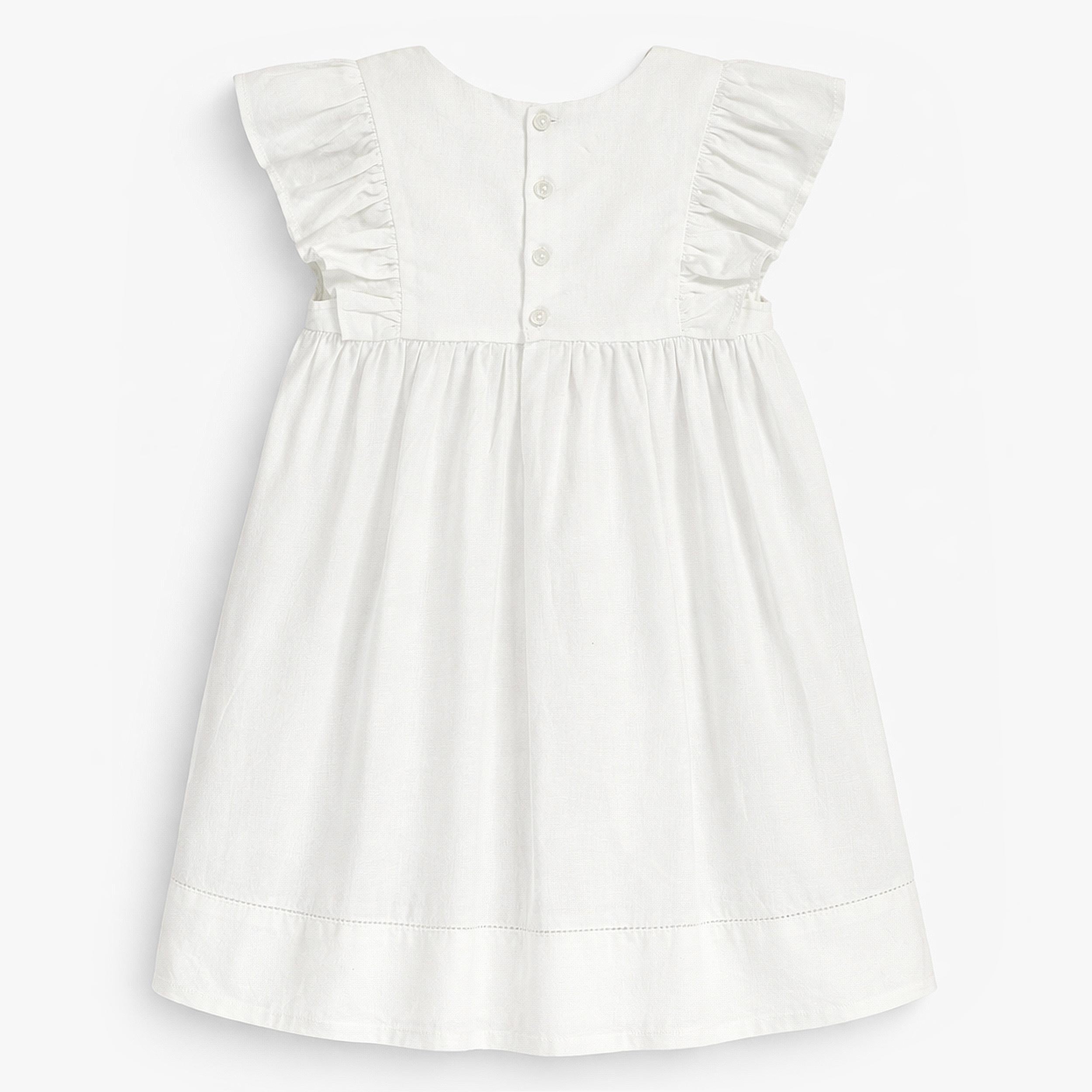 Dos de la robe blanche en coton et lin, bébé