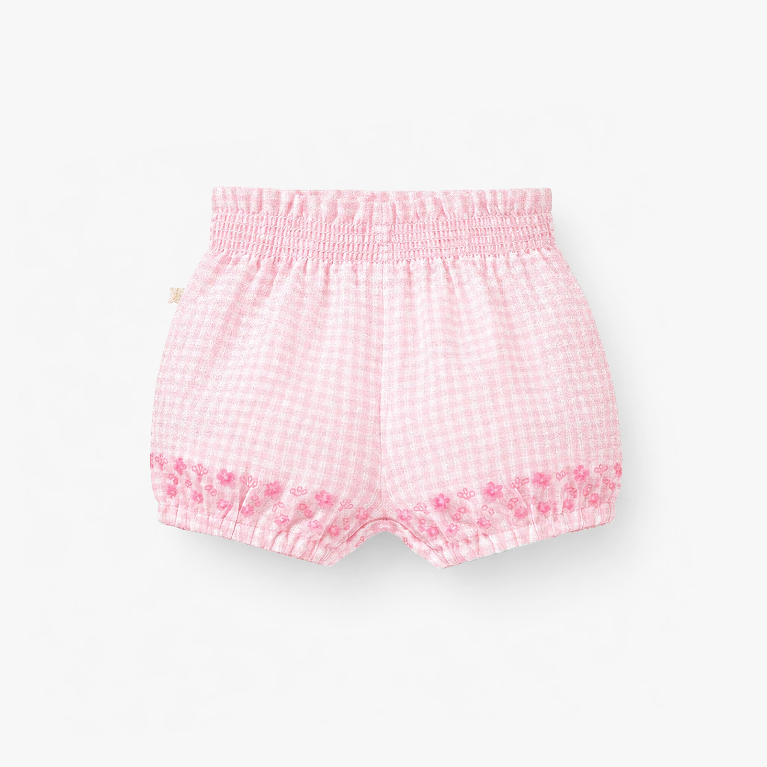 Dos du short rose à carreaux et broderie anglaise, naissance 