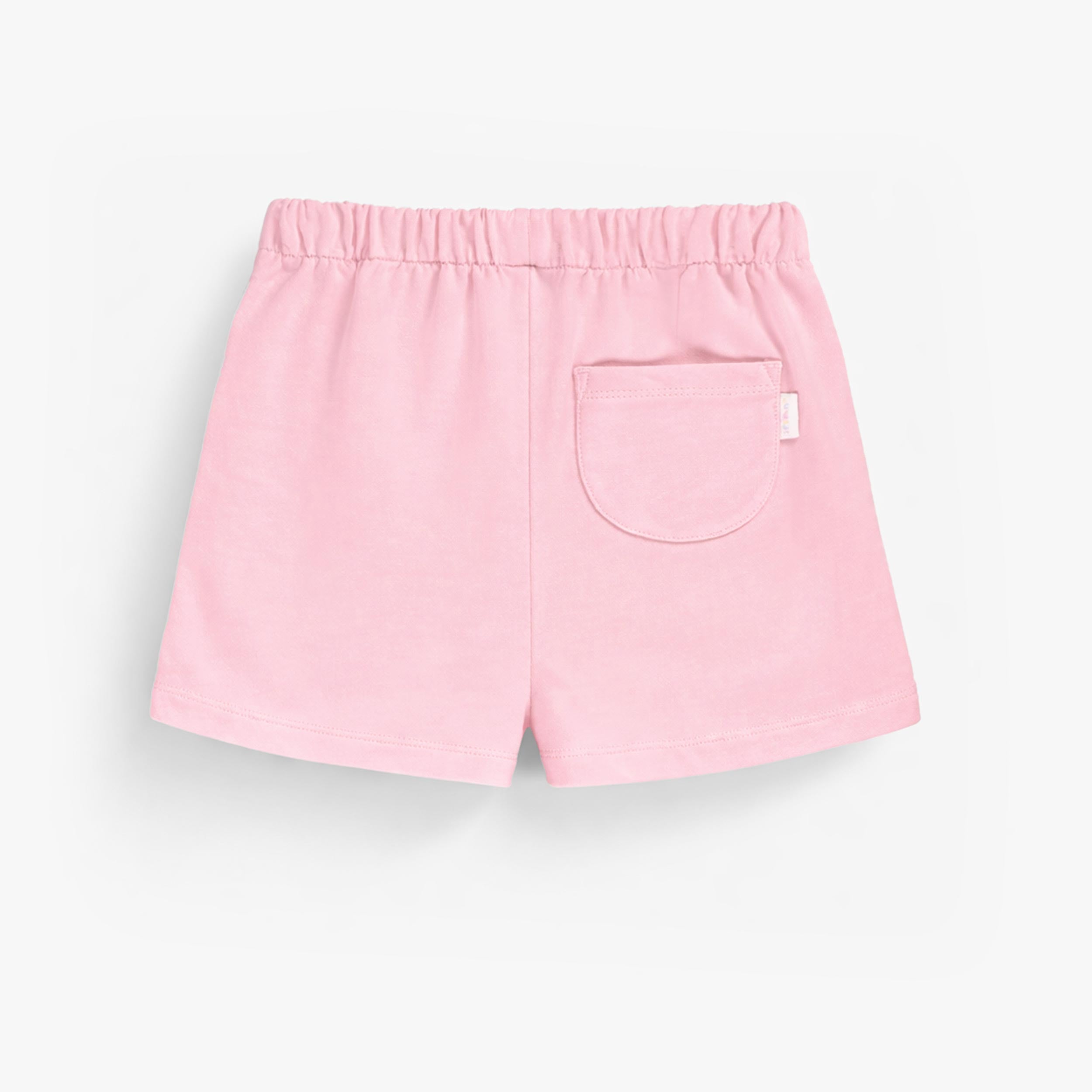 Dos du short rose en tricot français, enfant