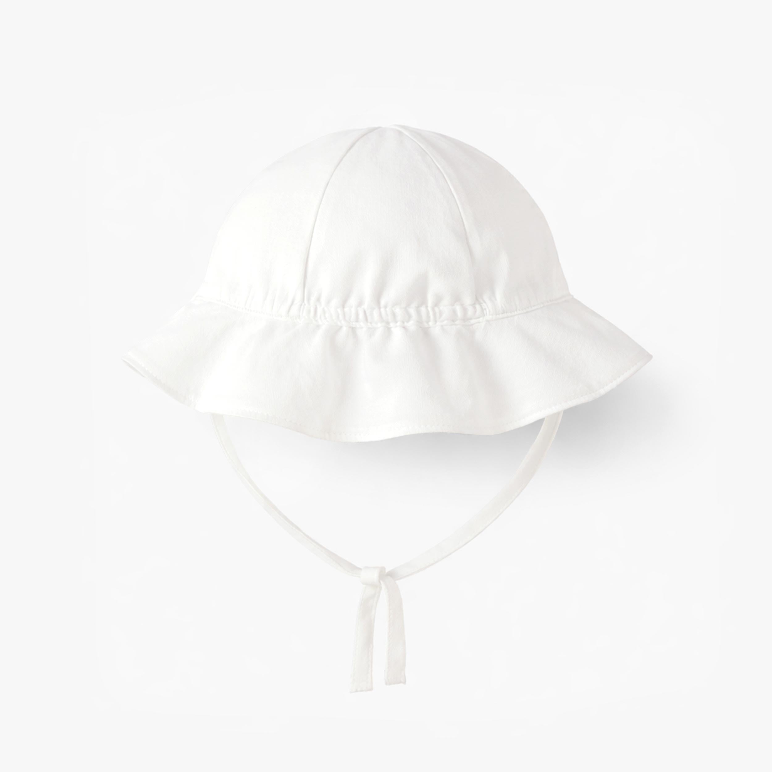 Dos du chapeau cloche blanc avec fleurs, bébé 