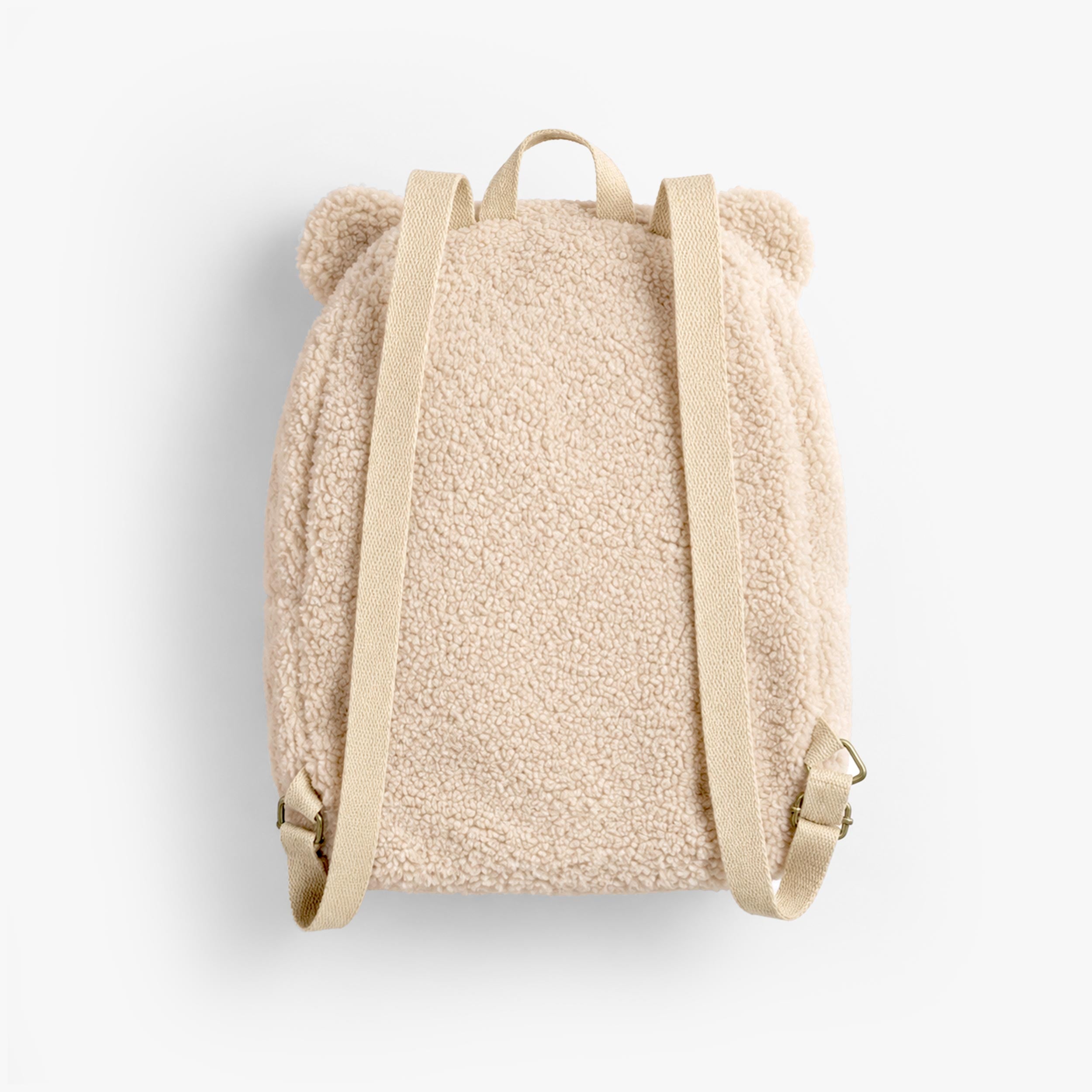 Dos du sac à dos crème en sherpa à visage d’ourson, bébé