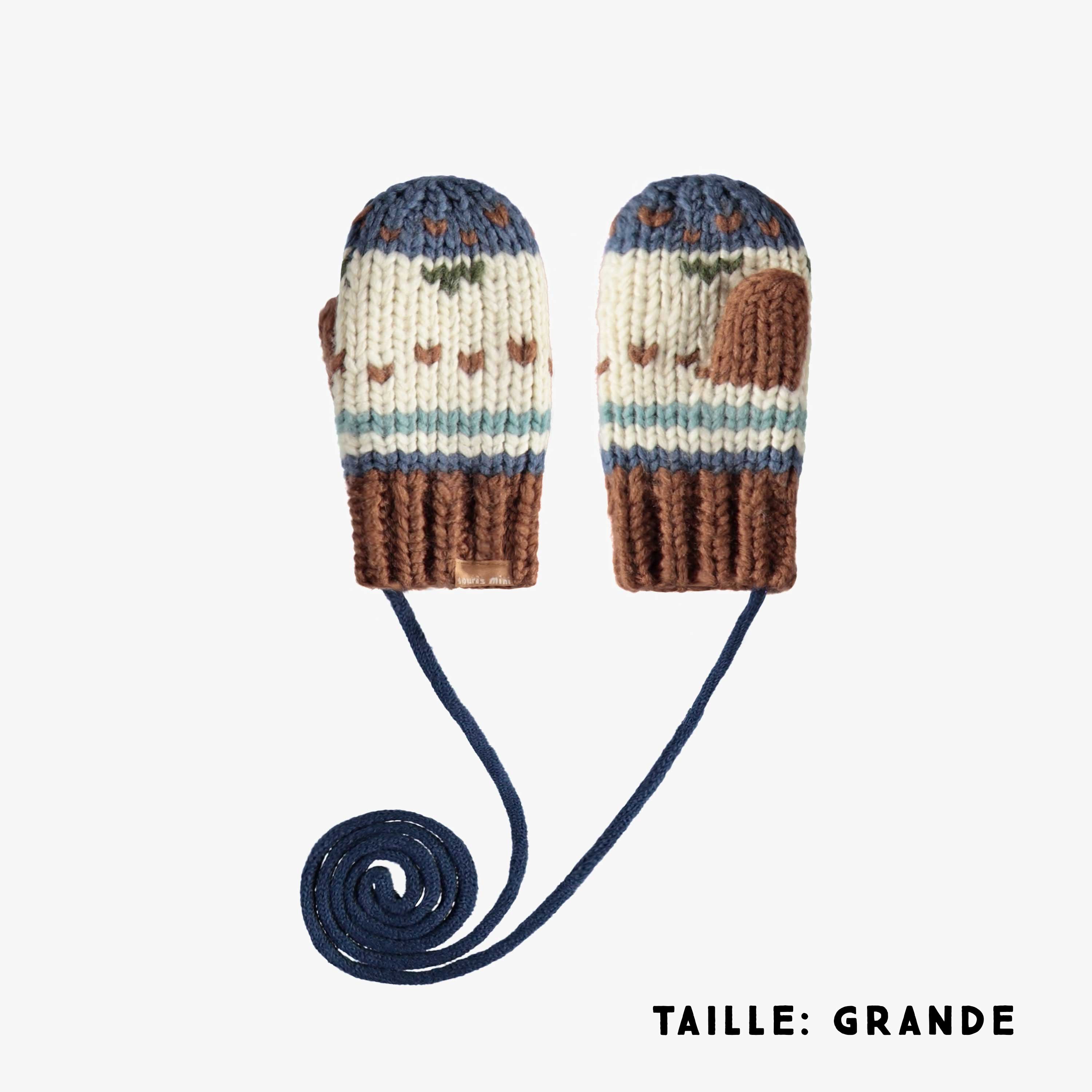 Cream and navy knitted mittens with a jacquard print and a cord, baby