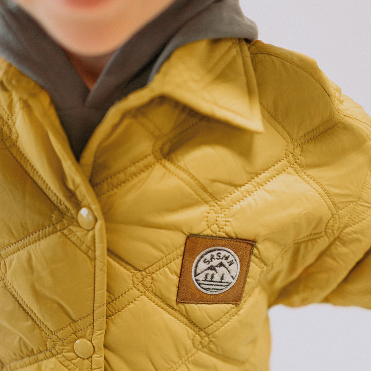 Manteau jaune orangé matelassé en nylon, enfant || Yellow-orange quilted nylon coat, child