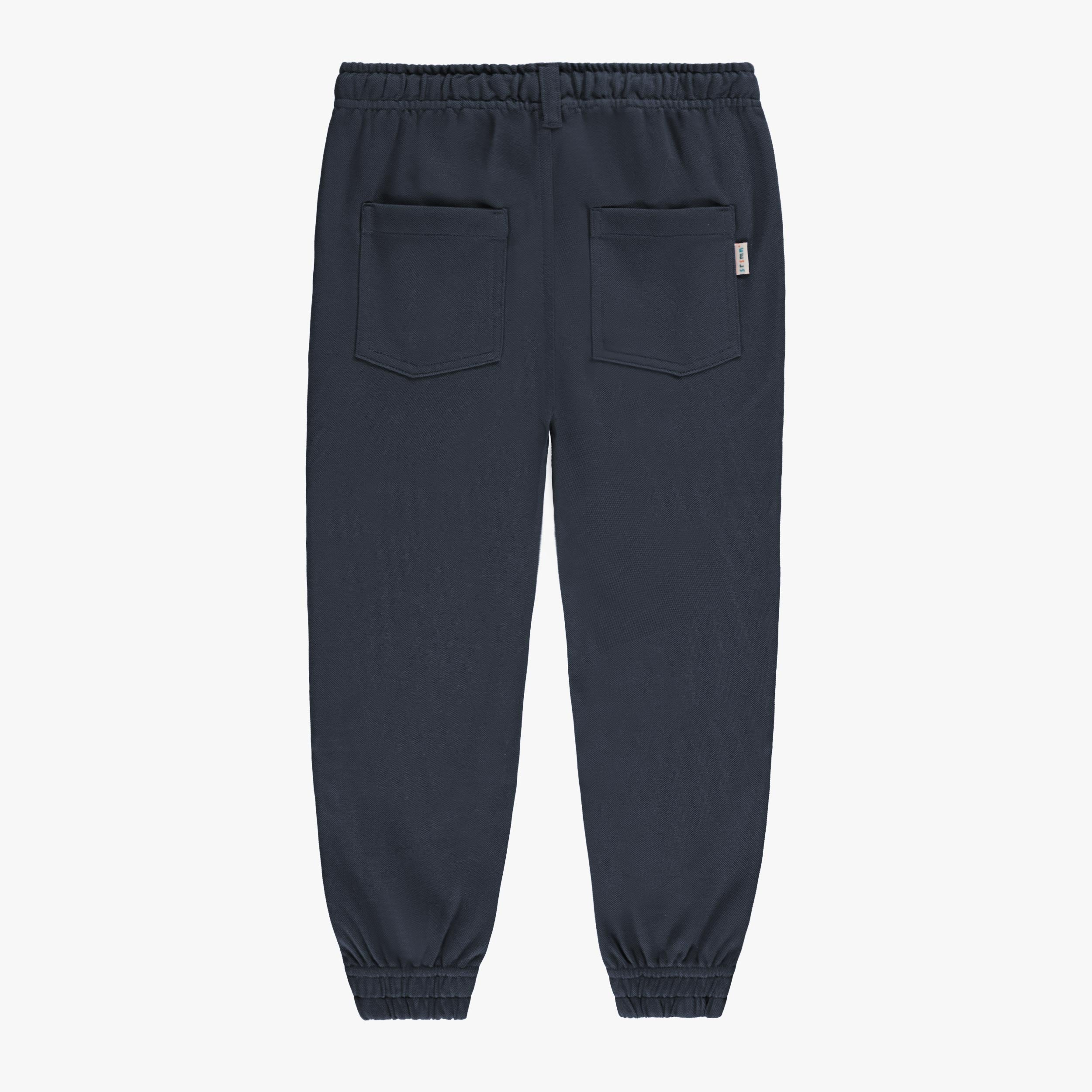 Dos du pantalon bleu marine style jogger, enfant