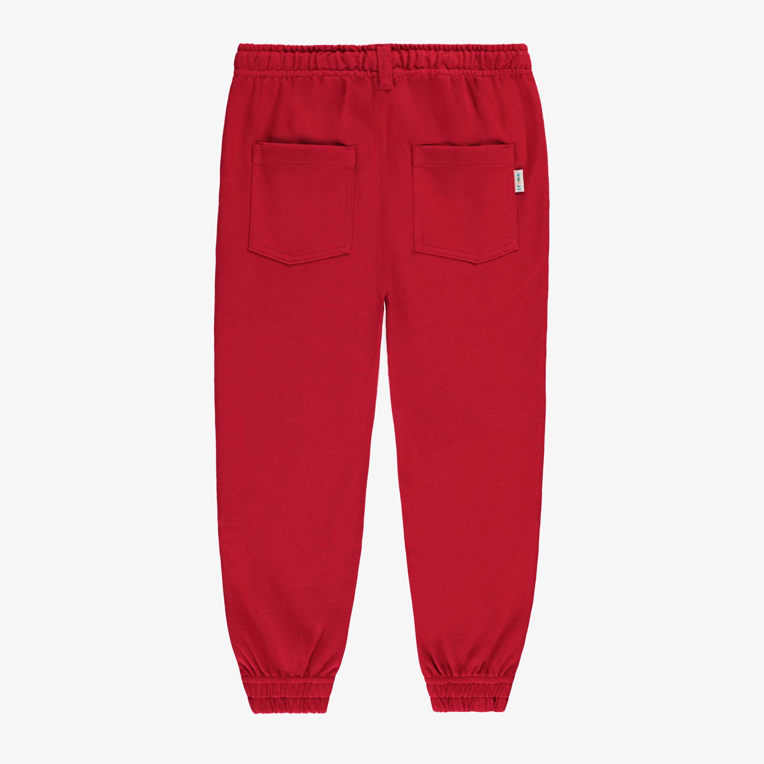 Dos du pantalon rouge style jogger, enfant