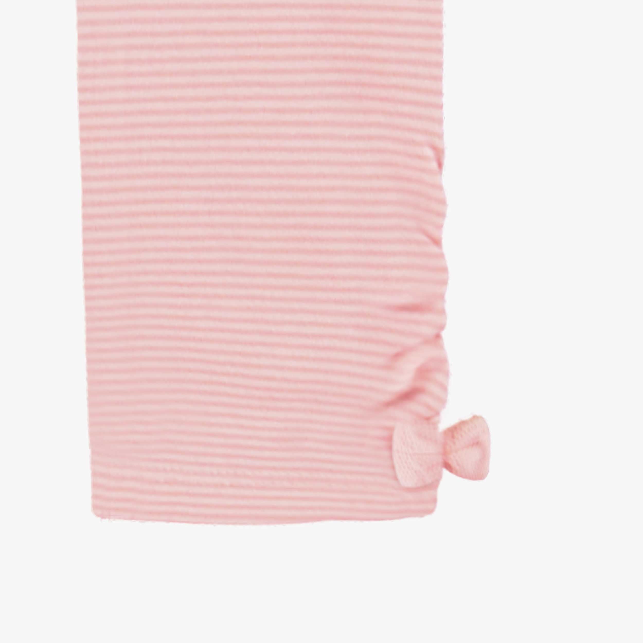 Zoom détails du legging rose avec cœurs, enfant