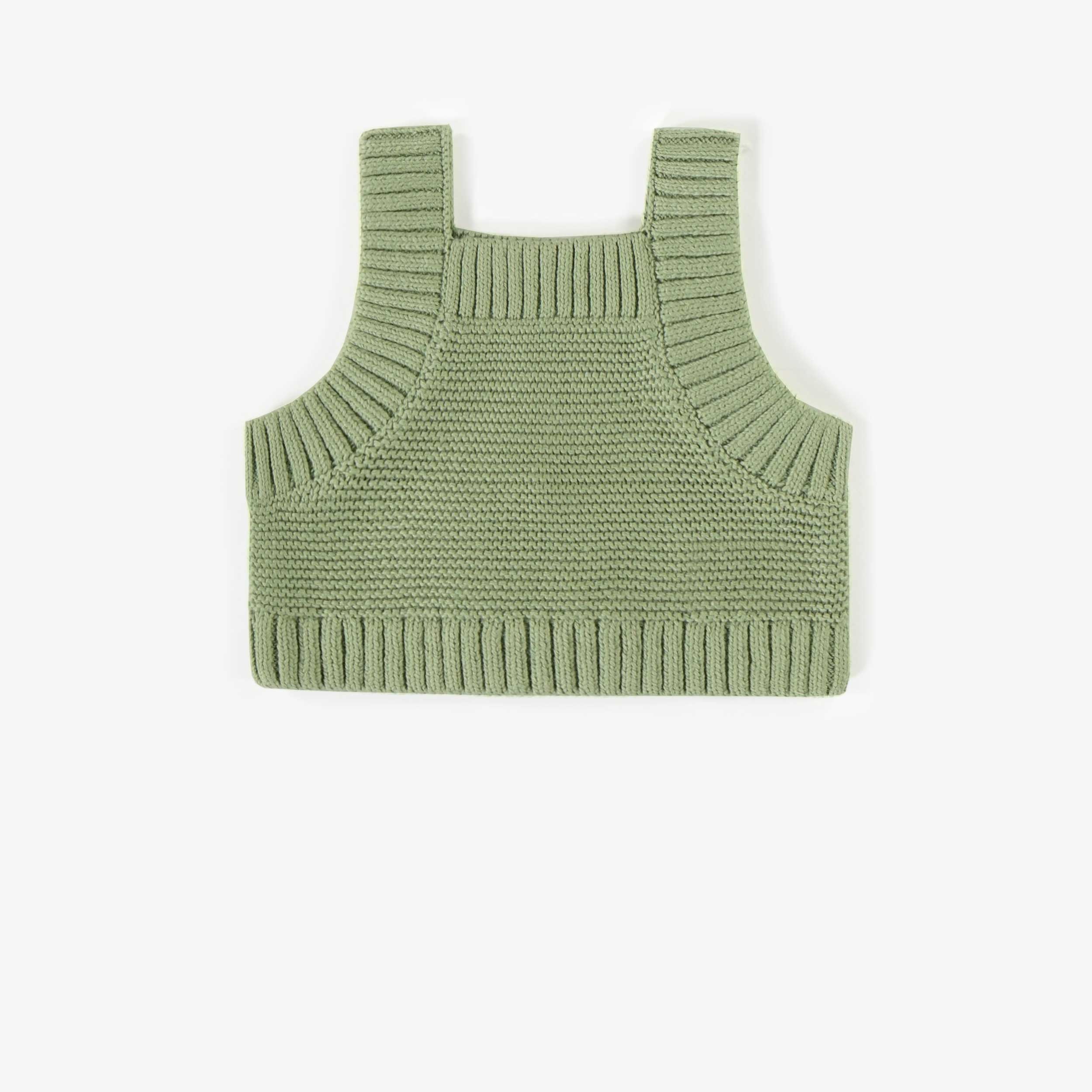 Dos de la camisole verte en maille, naissance