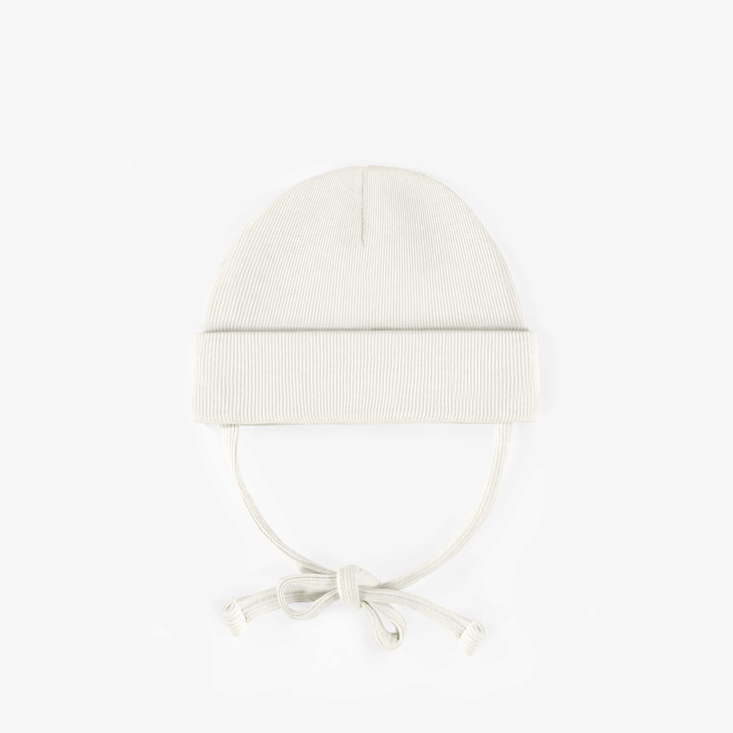 Cream outdoor hat with cords in ribbed knit, newborn