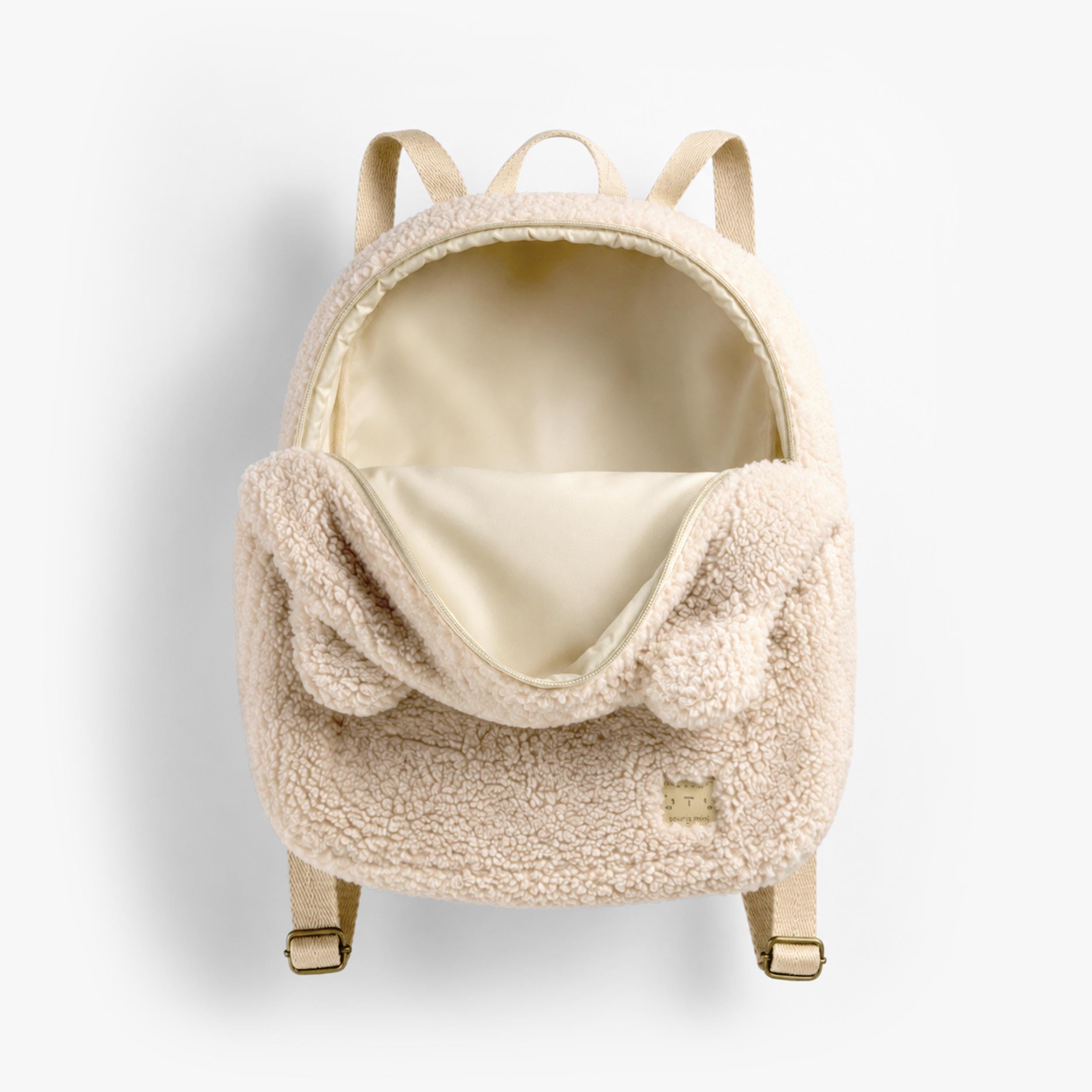 Ouverture du sac à dos crème en sherpa à visage d’ourson, bébé