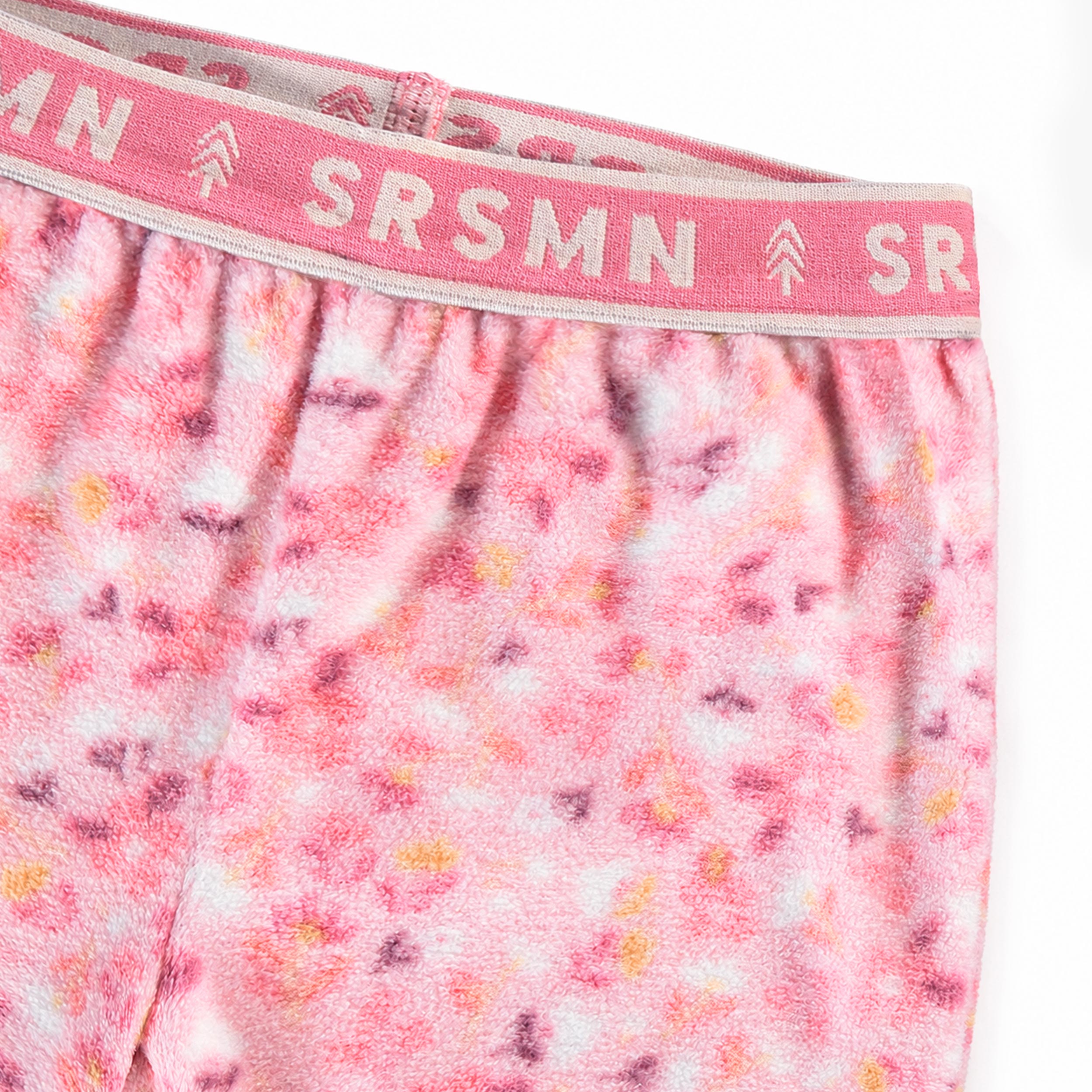 Pantalon rose en polar à imprimé floral pour bébé avec taille élastique à logo.
