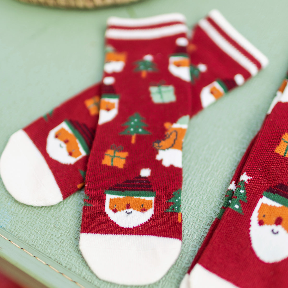 Red socks with festive patterns, baby