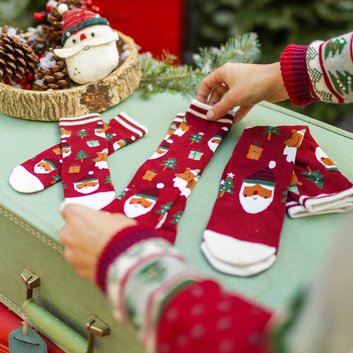 Red socks with festive patterns, adult
