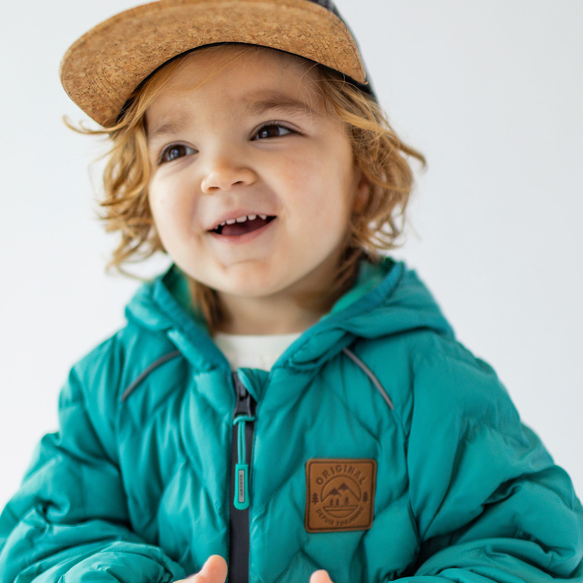 Turquoise puffer jacket with chevron quilting, baby