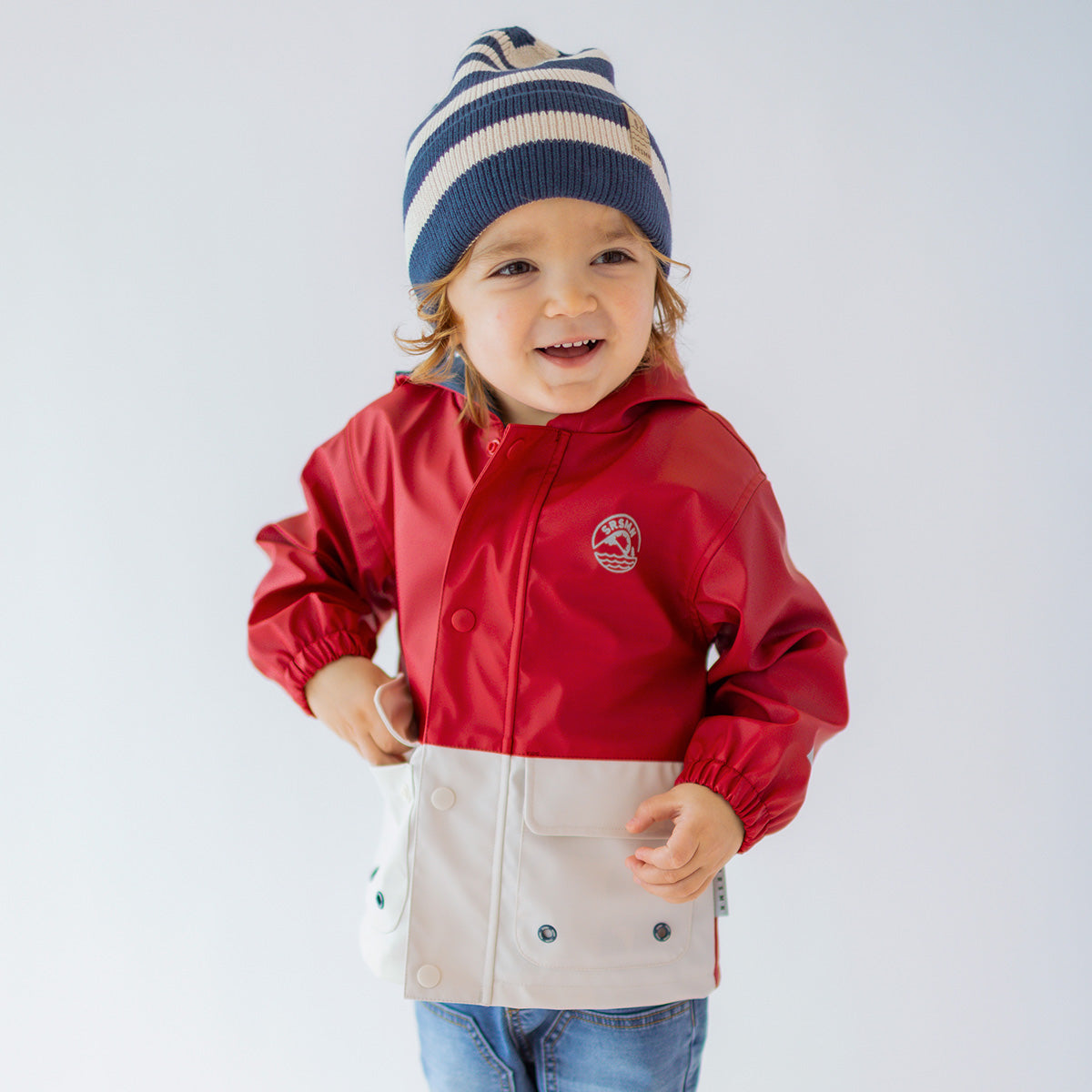 Red and cream raincoat, baby