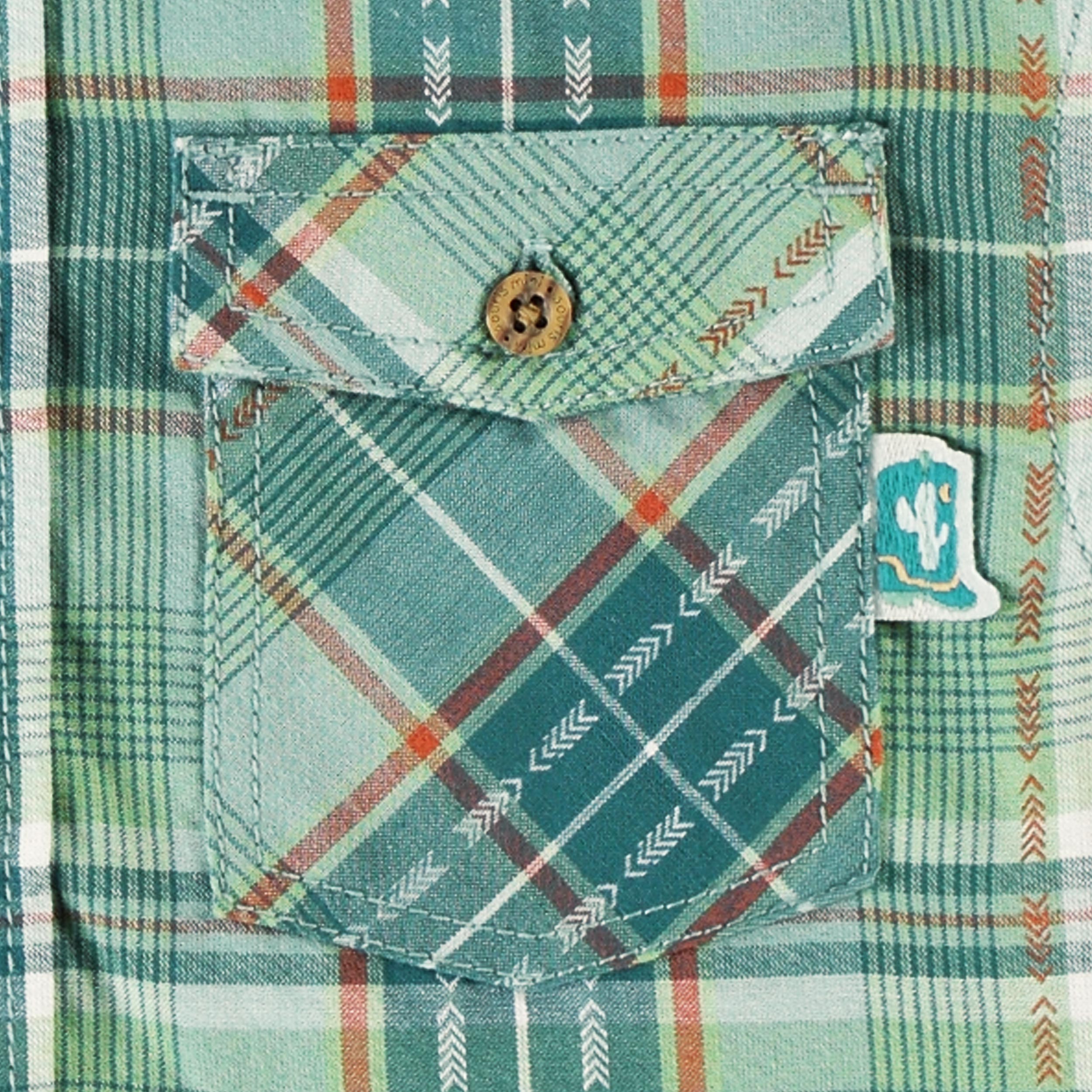 Zoom détails de la poche avant de la chemise turquoise à carreaux, enfant