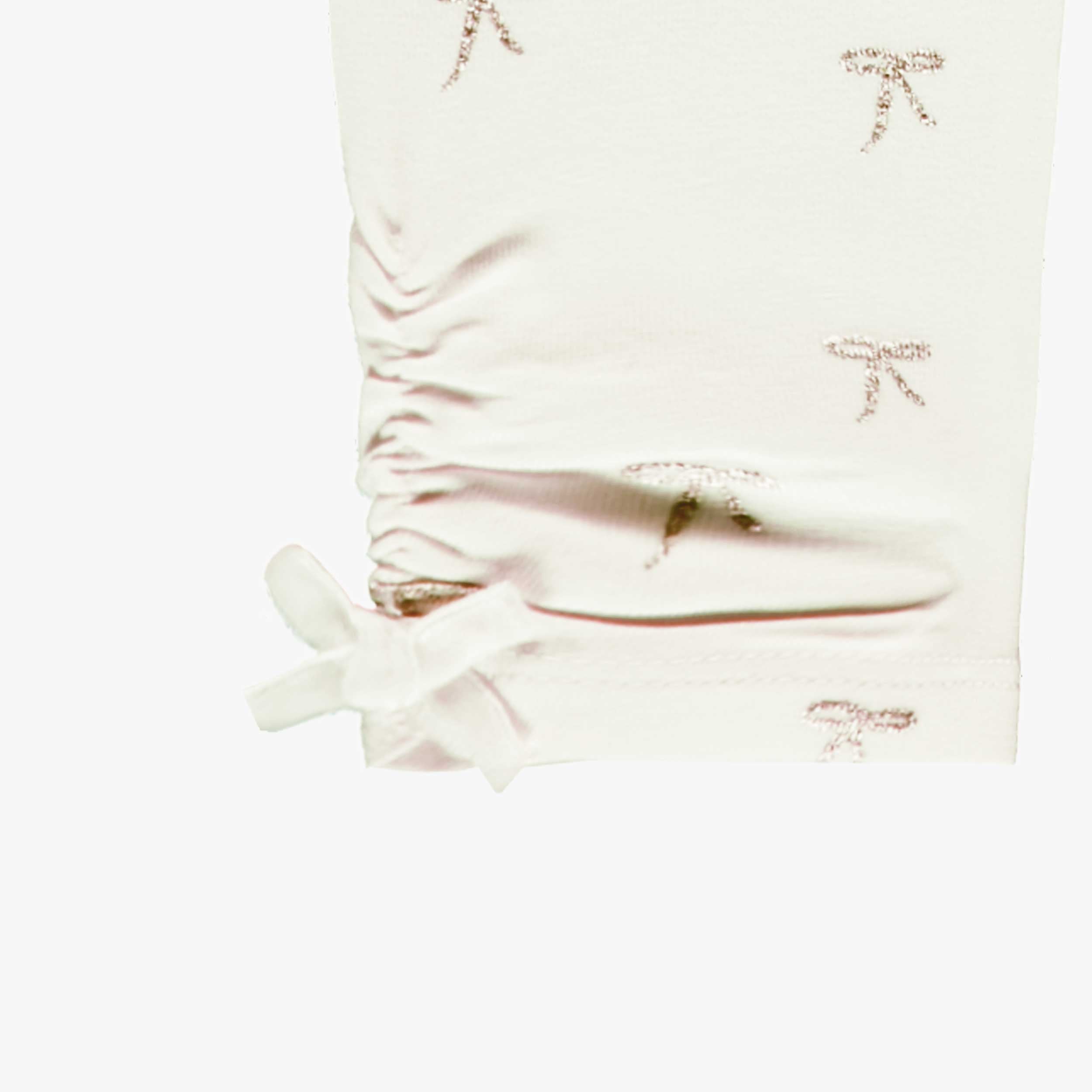 Zoom legging crème avec motifs de boucles, bébé 