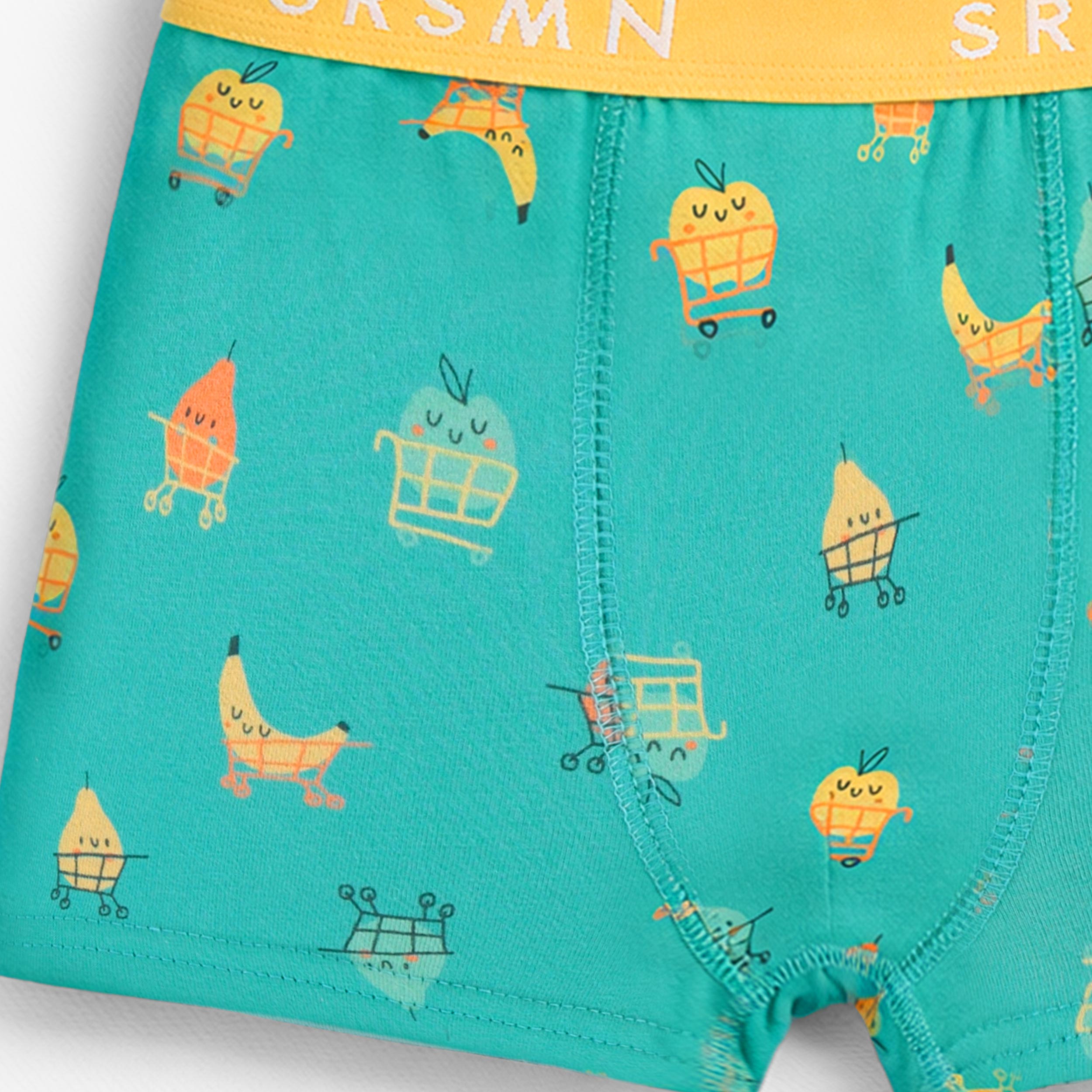 Zoom détails du boxer vert à motifs fruités, enfant