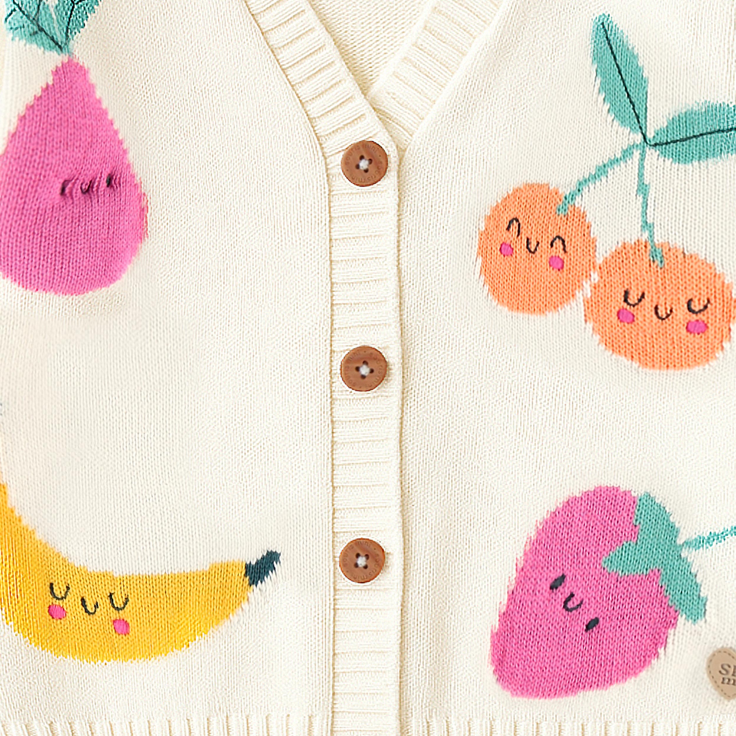 Zoom détails du cardigan crème en tricot avec motifs de fruits, enfant 