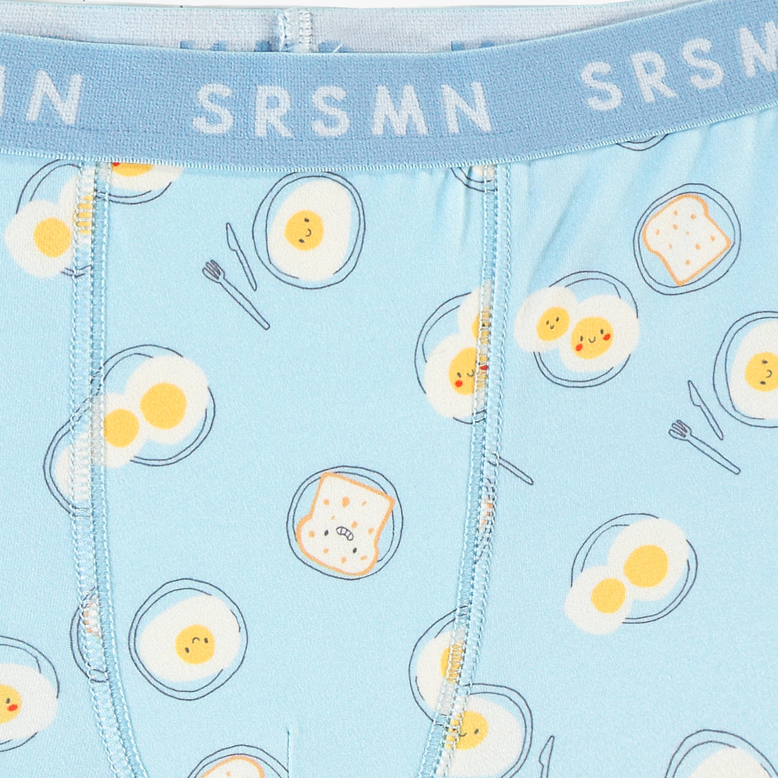 Zoom détails du boxer bleu à motifs de déjeuner, enfant 