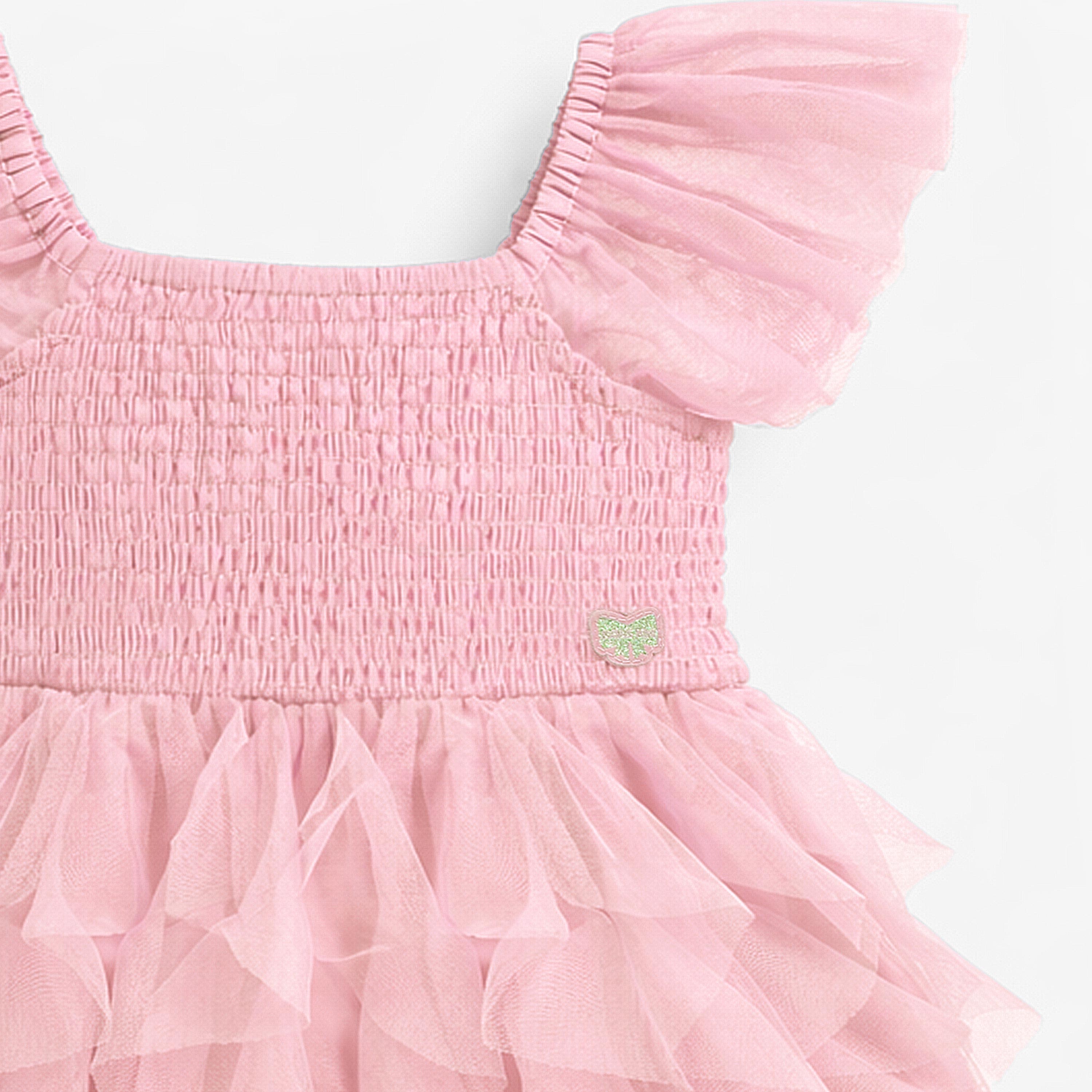 Zoom détails nid abeille de la robe rose en tulle souple, enfant