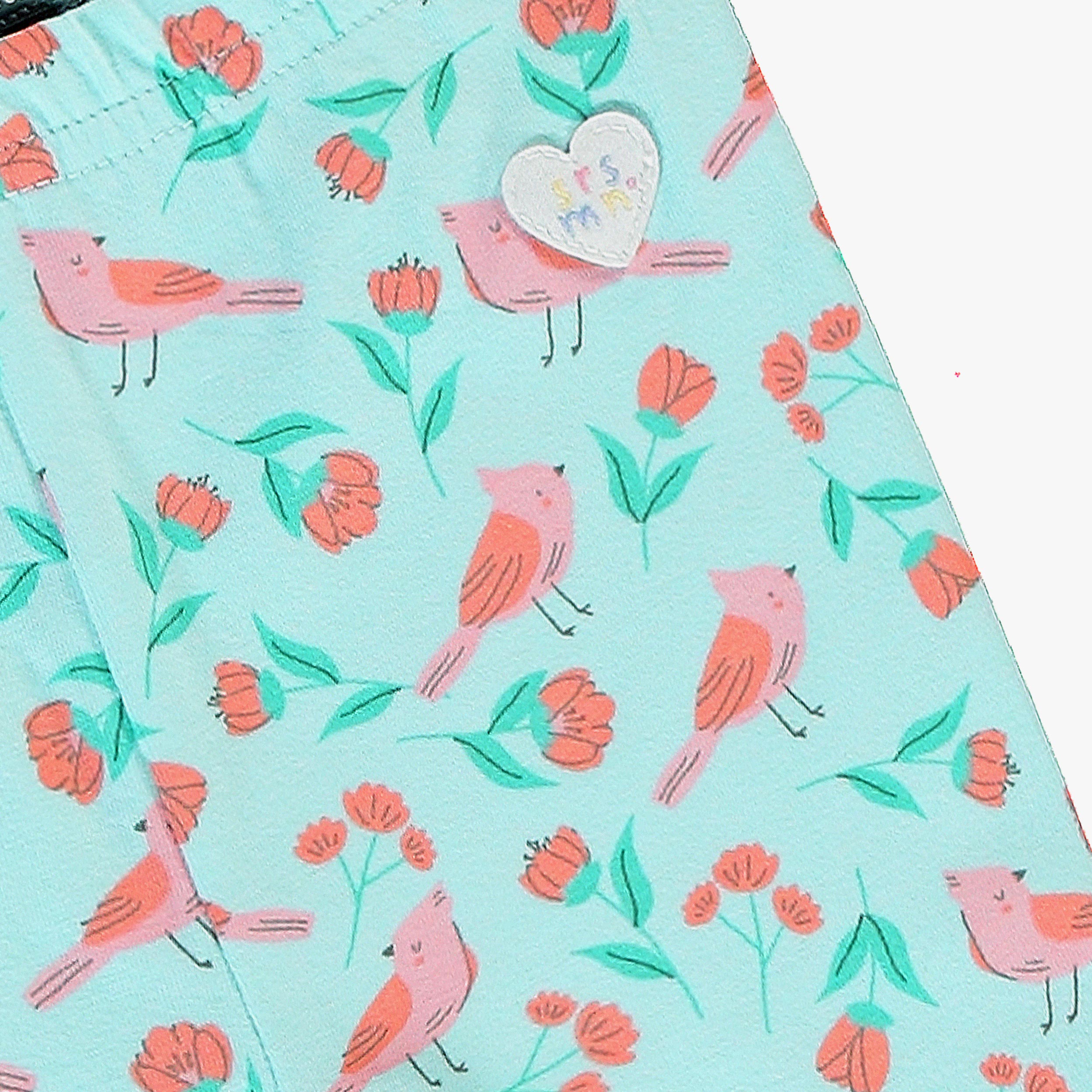 Zoom détails du legging court turquoise en jersey extensible avec motifs, bébé 
